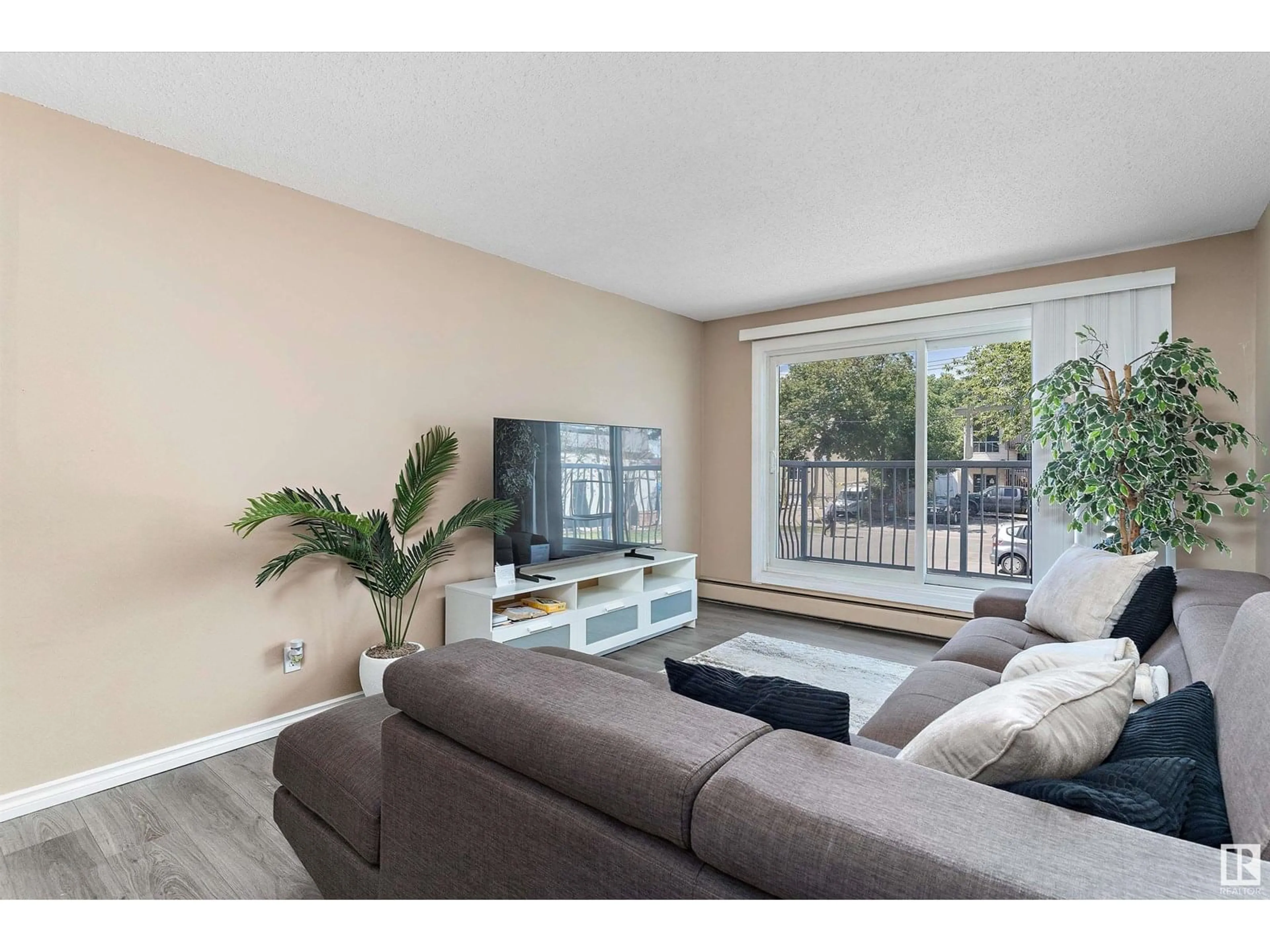 Living room with furniture, wood/laminate floor for #206 - 10330 113 ST, Edmonton Alberta T5K1P6