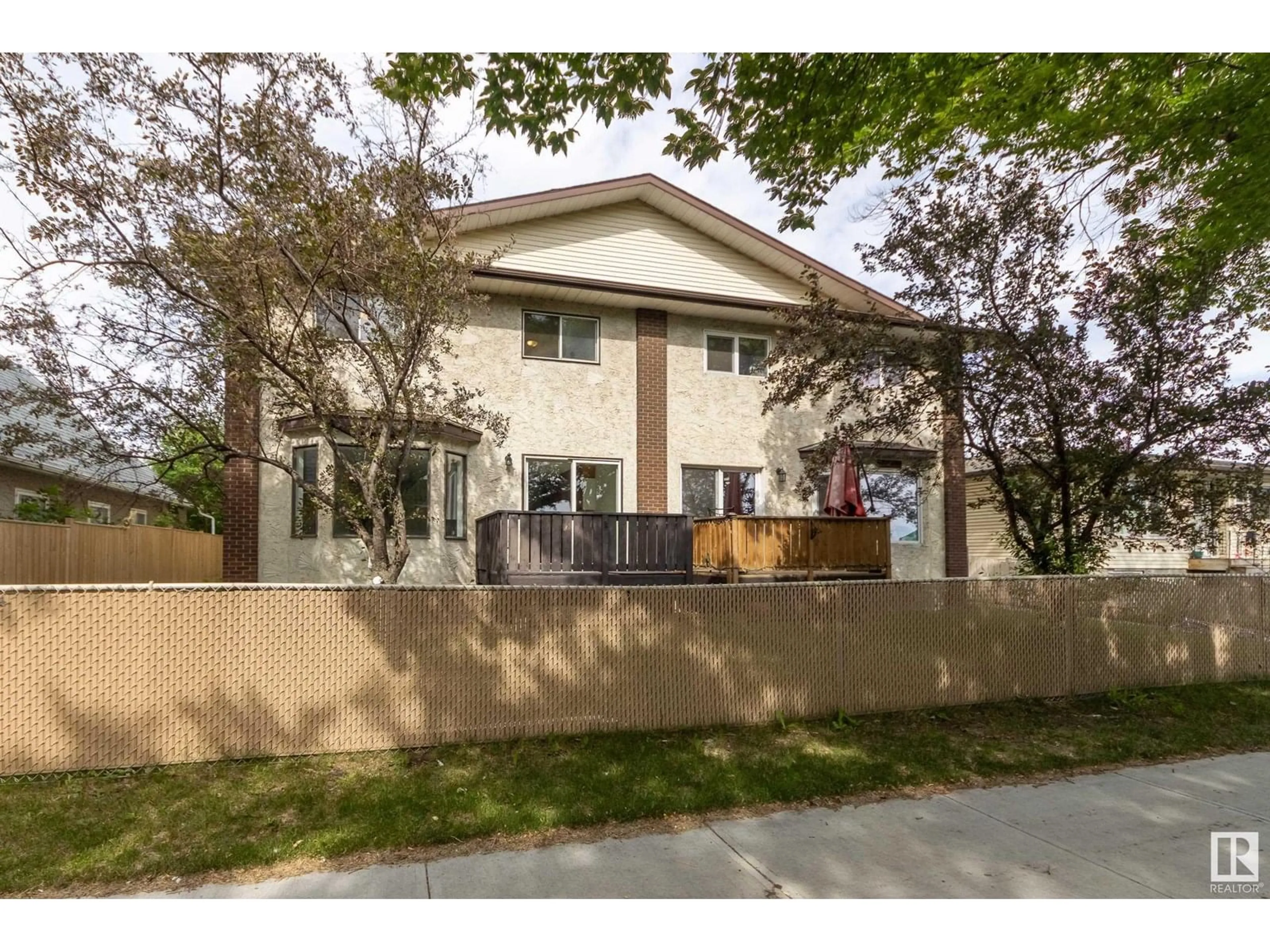 Home with vinyl exterior material, street for 12430 85 ST, Edmonton Alberta T5B3H2