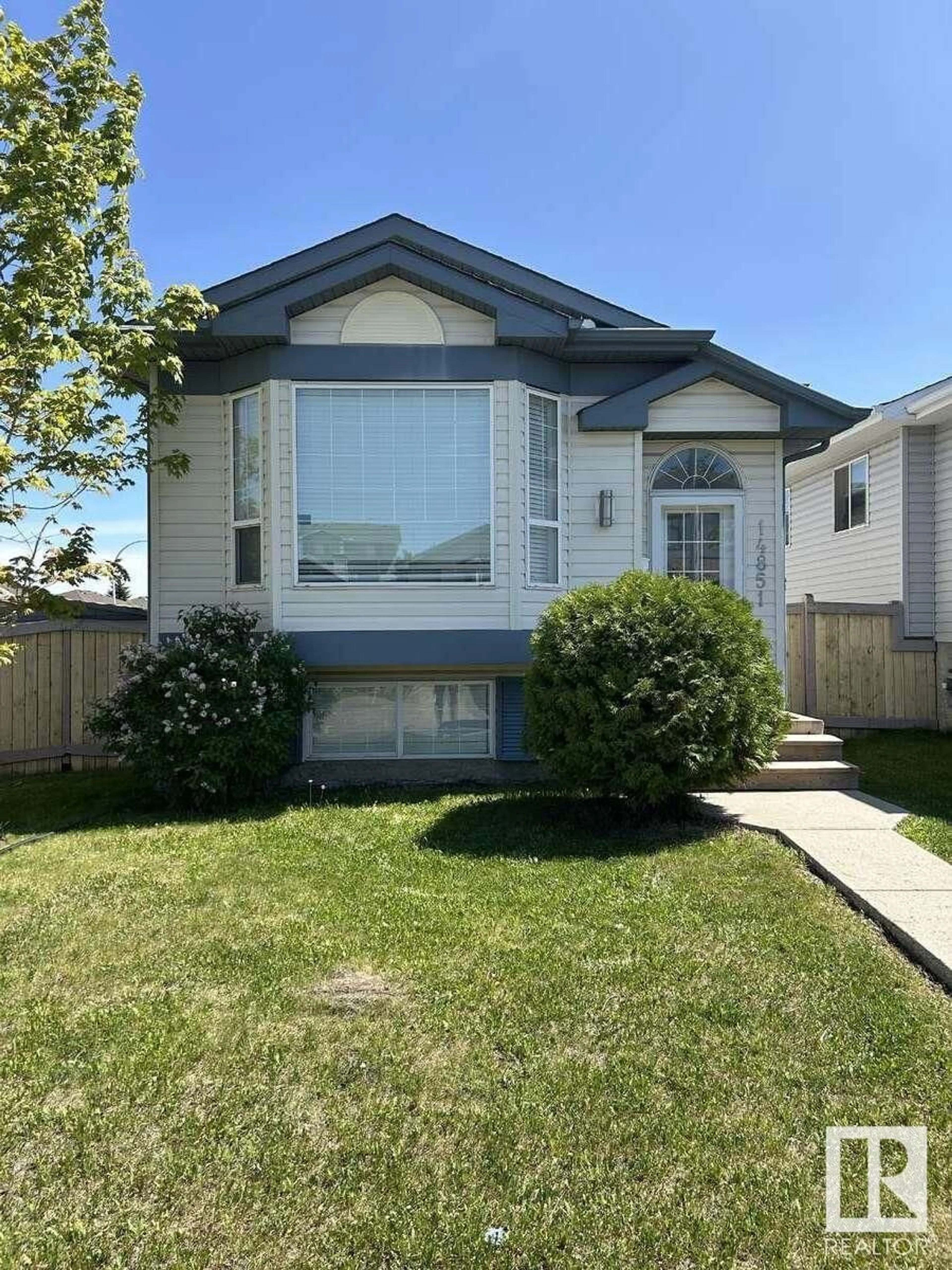 Home with vinyl exterior material, street for NW - 14851 47 ST, Edmonton Alberta T5Y2X3