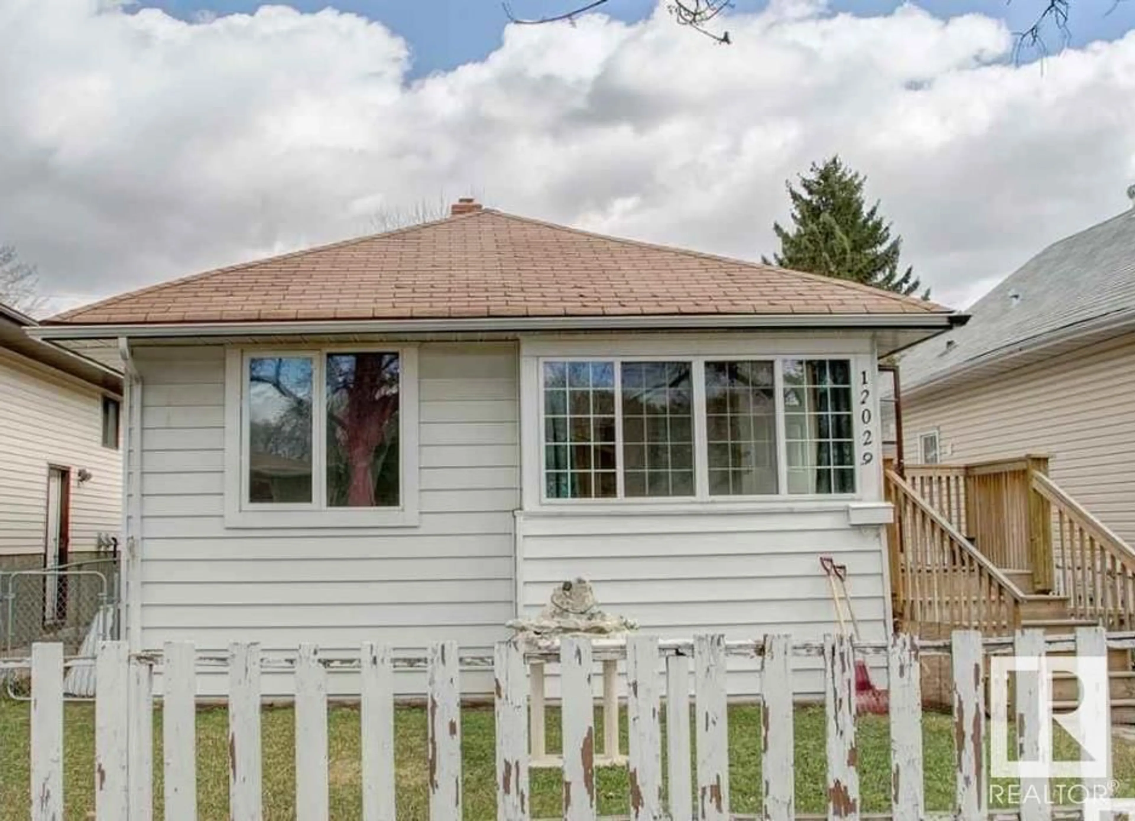 Home with vinyl exterior material, street for 12029 94 ST, Edmonton Alberta T5G1J8
