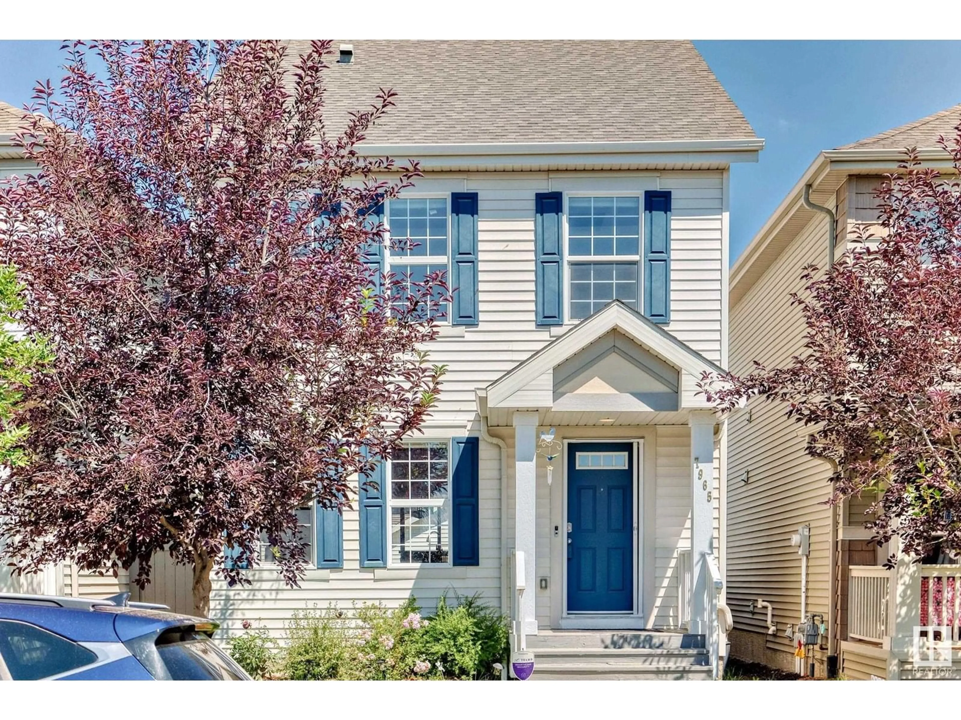 Home with vinyl exterior material, street for 7965 ERASMUS CR, Edmonton Alberta T6M0S2