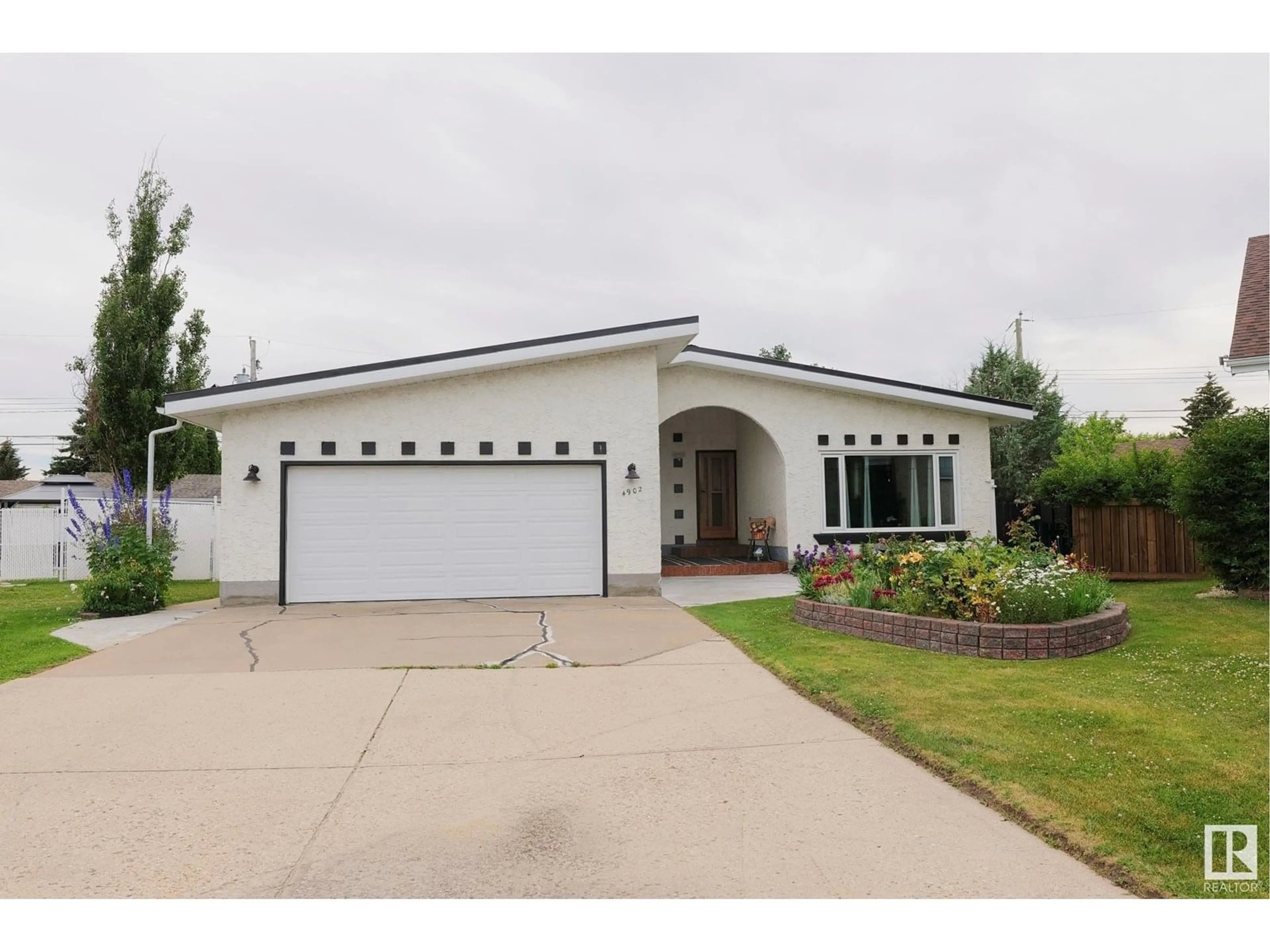 Home with vinyl exterior material, street for 4902 43A ST, Barrhead Alberta T7N1J5