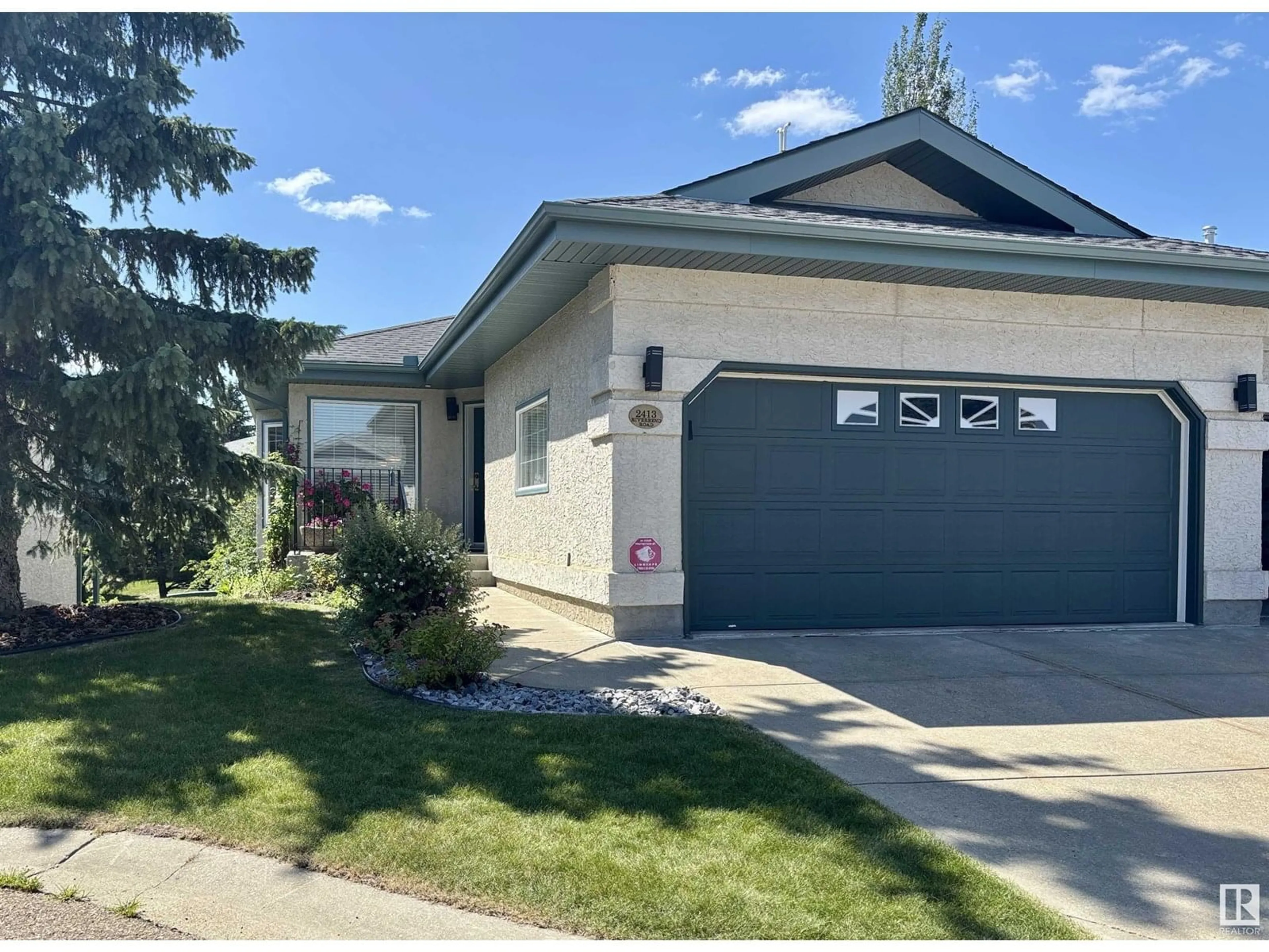 Home with vinyl exterior material, street for 2413 RIVERBEND RD, Edmonton Alberta T6R2Z2