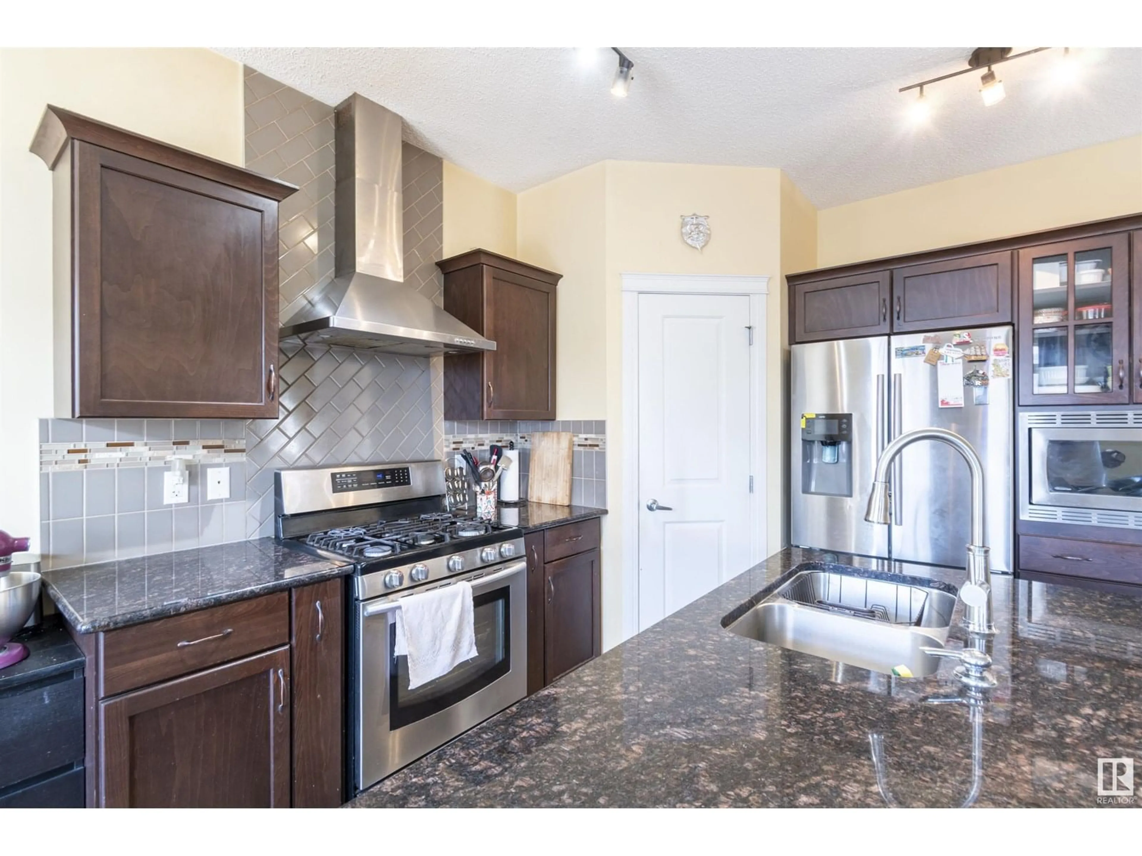 Open concept kitchen, ceramic/tile floor for 1840 56 ST, Edmonton Alberta T6X1T6