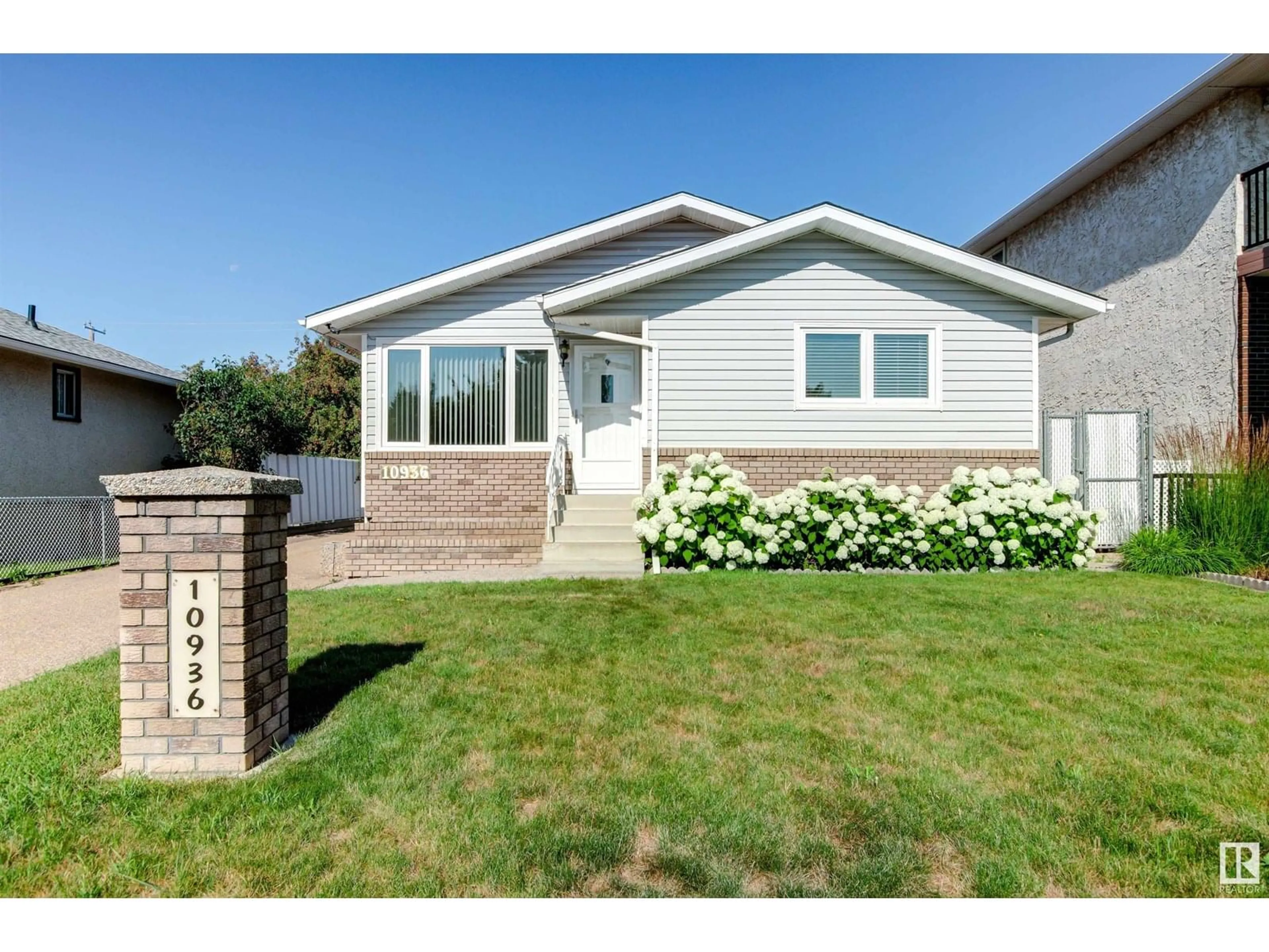 Home with vinyl exterior material, street for NW - 10936 151 ST, Edmonton Alberta T5P1W1