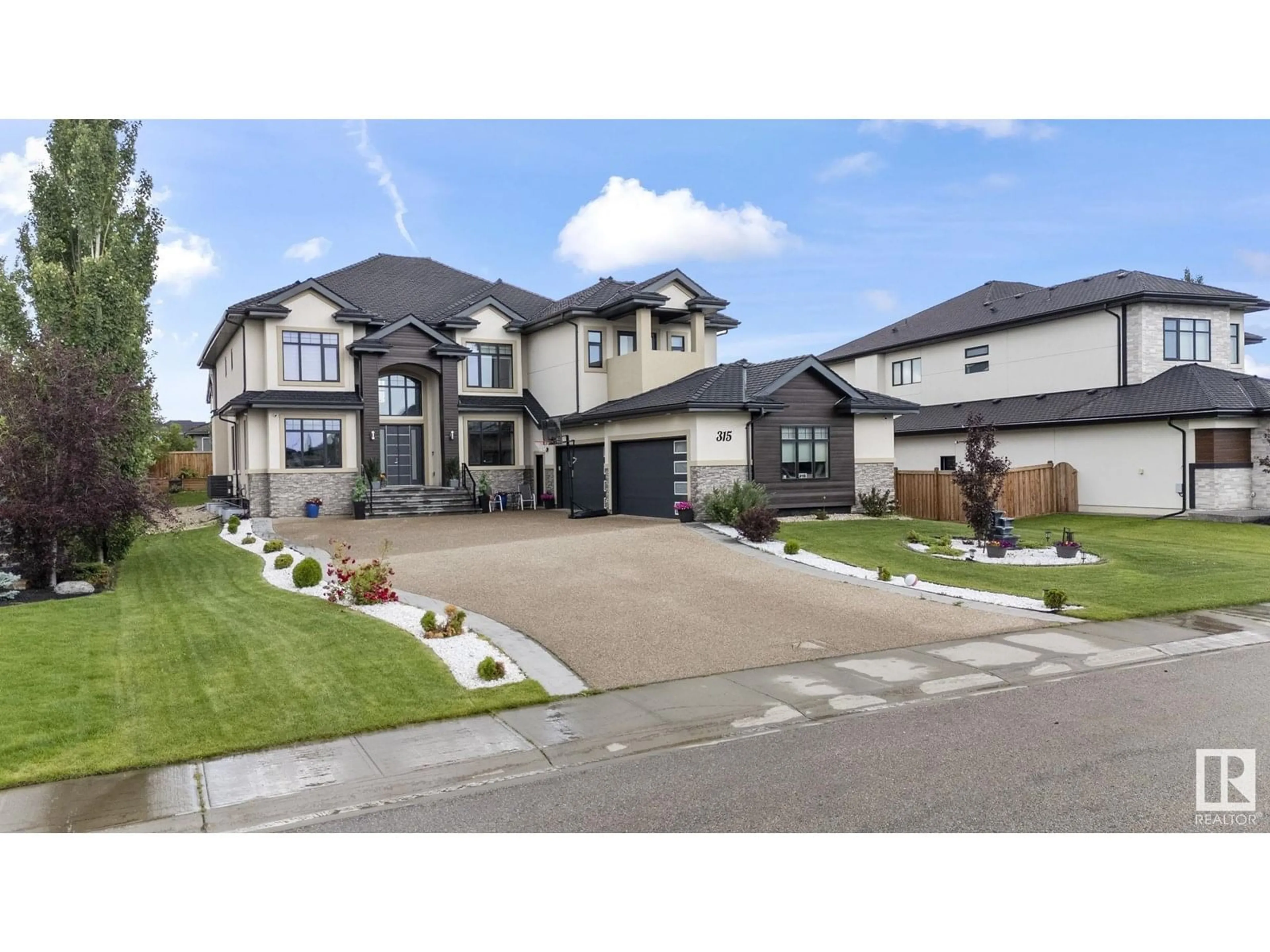 Home with vinyl exterior material, street for 52327 - 315 RGE ROAD 233, Rural Strathcona County Alberta T8B1C6