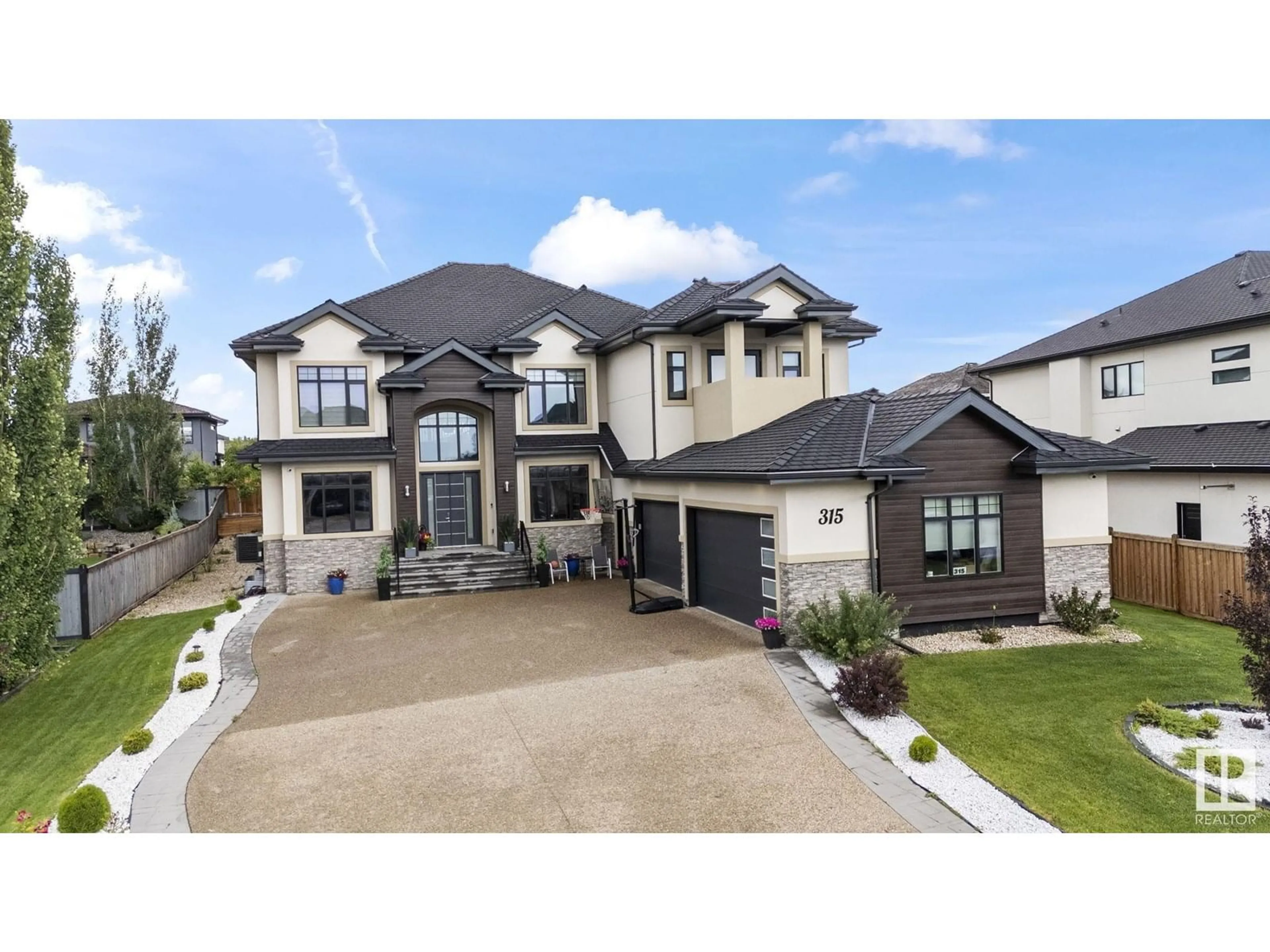 Home with vinyl exterior material, street for 52327 - 315 RGE ROAD 233, Rural Strathcona County Alberta T8B1C6
