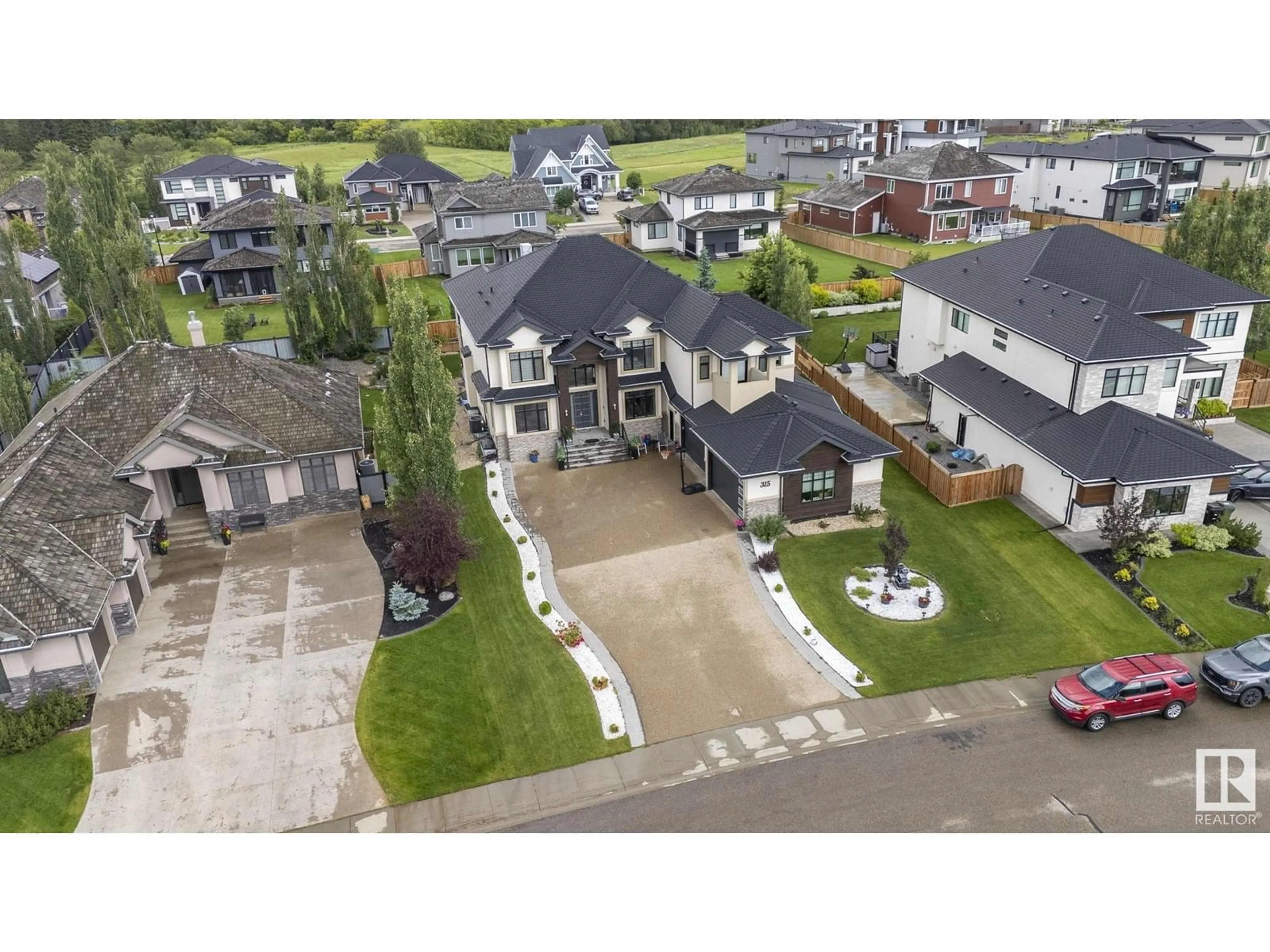 A pic from outside/outdoor area/front of a property/back of a property/a pic from drone, street for 52327 - 315 RGE ROAD 233, Rural Strathcona County Alberta T8B1C6