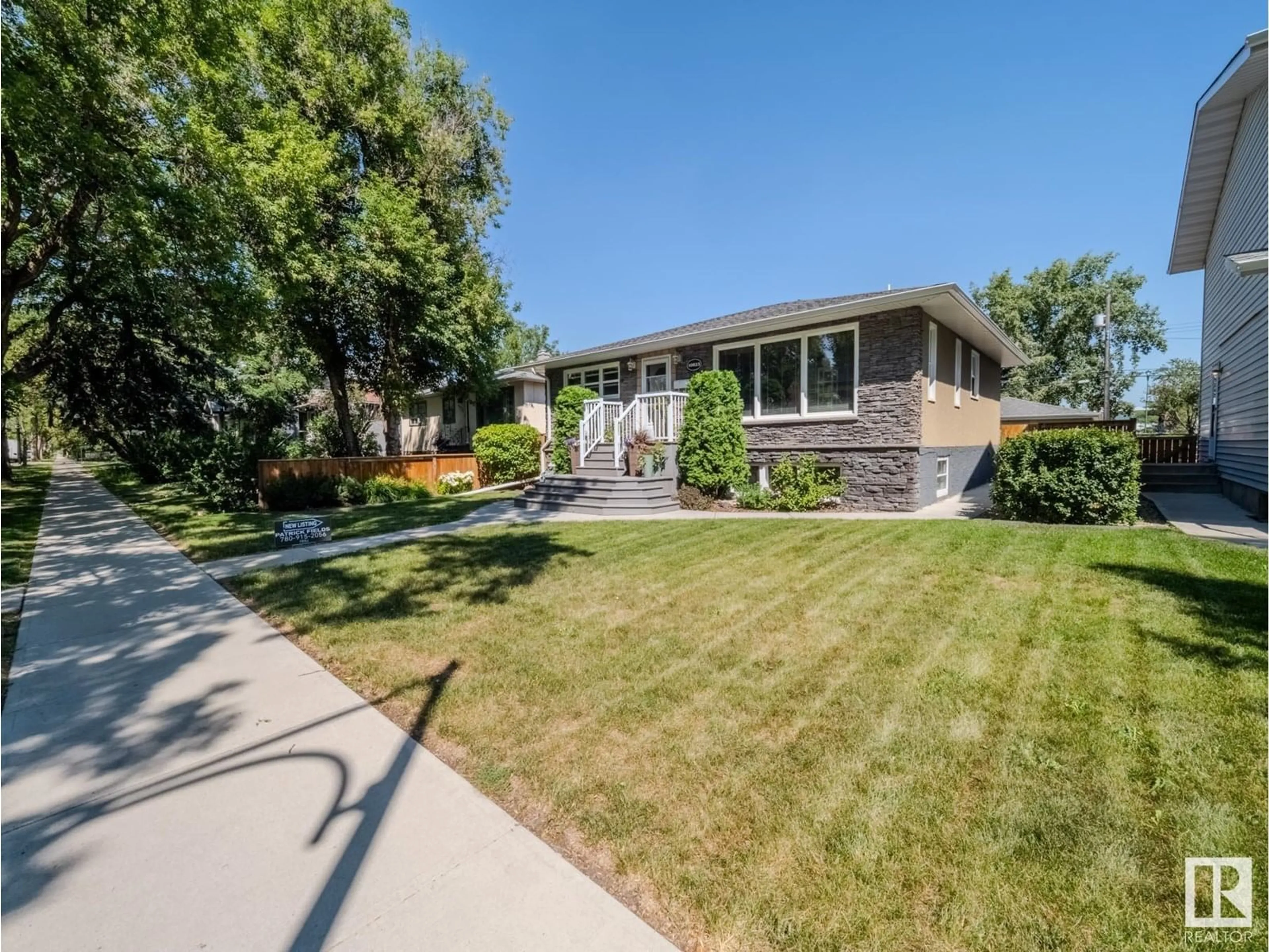 Home with vinyl exterior material, street for NW - 10823 122 ST, Edmonton Alberta T5M0A5