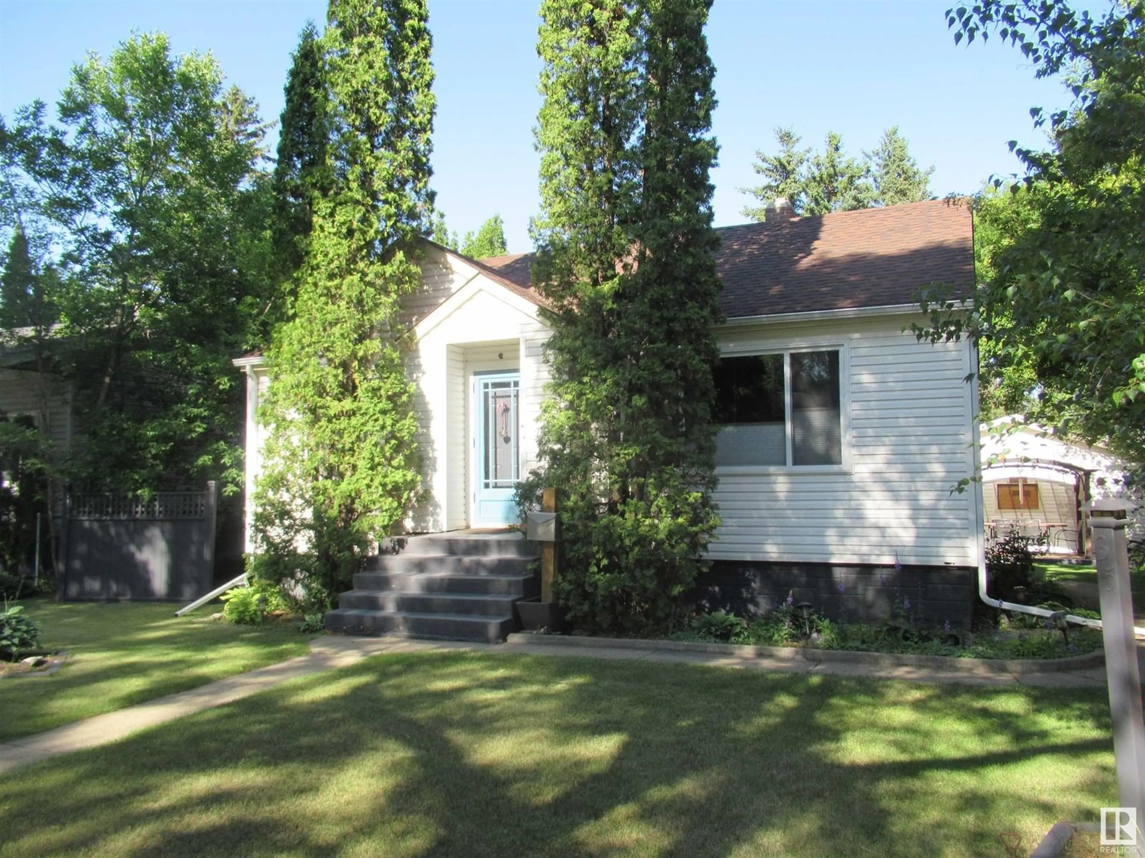 Home with vinyl exterior material, street for 11435 63 ST, Edmonton Alberta T5W4G1
