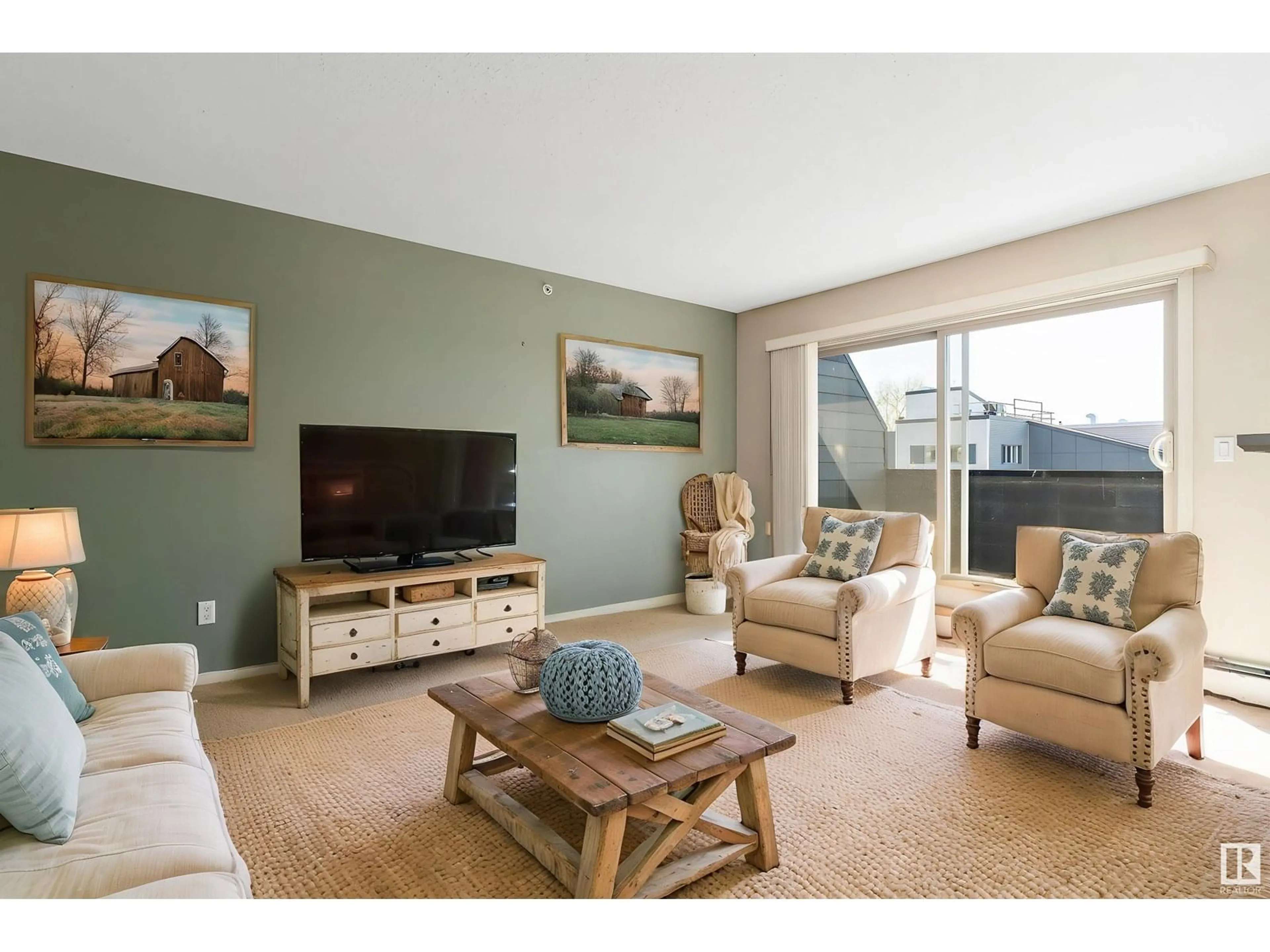 Living room with furniture, wood/laminate floor for #412 - 17011 67 AV, Edmonton Alberta T5T6Y6