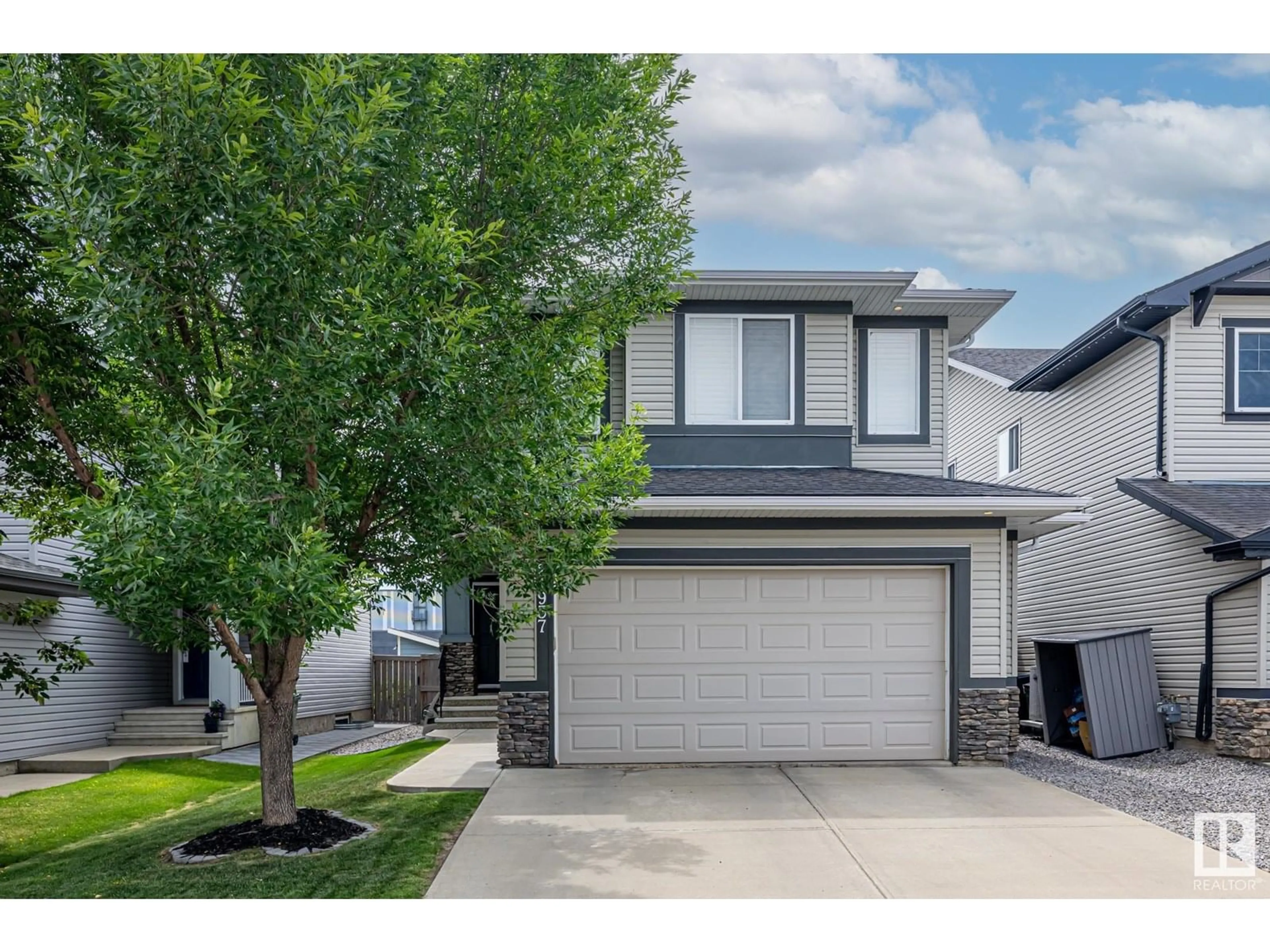 Home with vinyl exterior material, street for 21937 94A AV, Edmonton Alberta T5T1N1