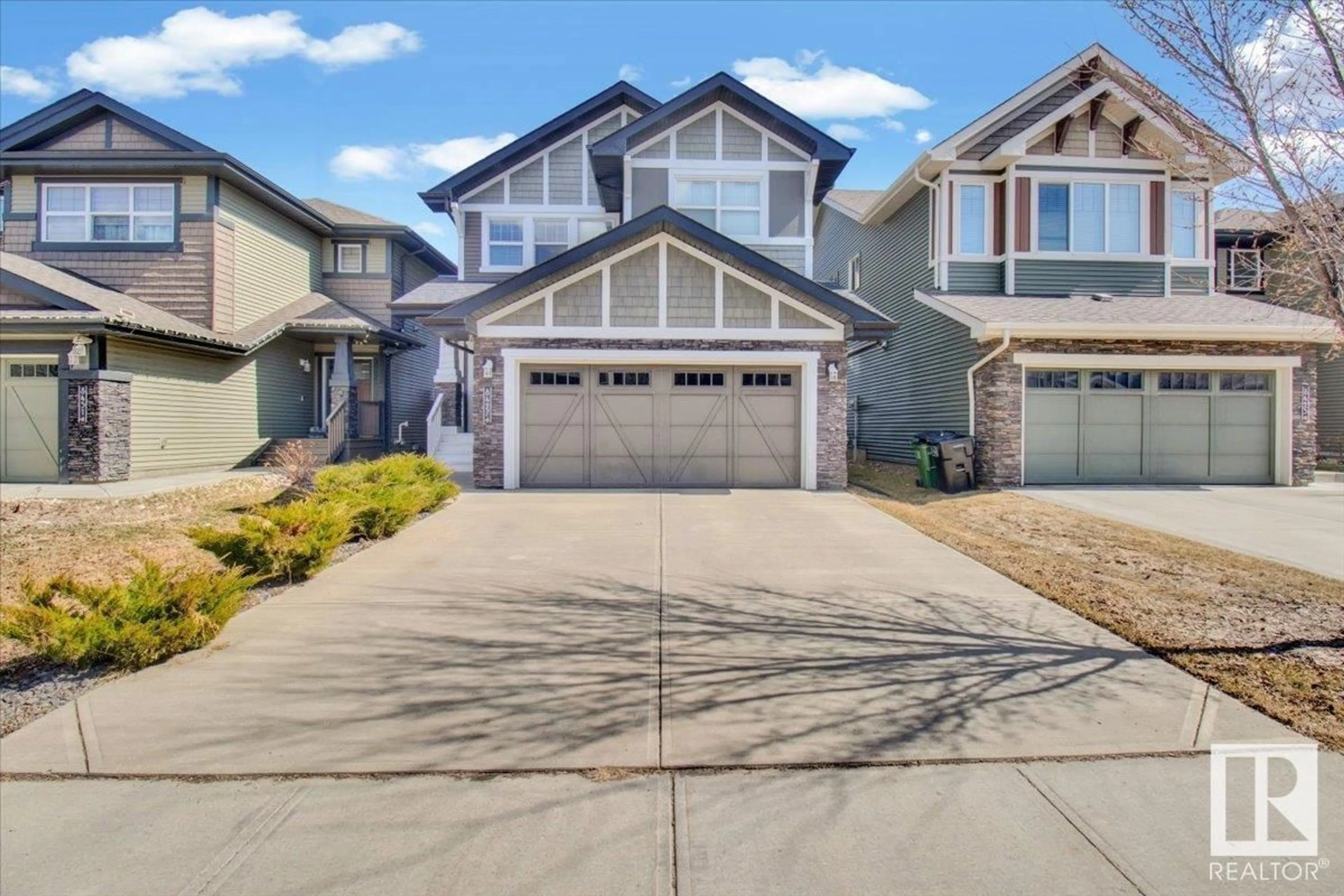 Home with vinyl exterior material, street for 8427 216 ST, Edmonton Alberta T5T4W2