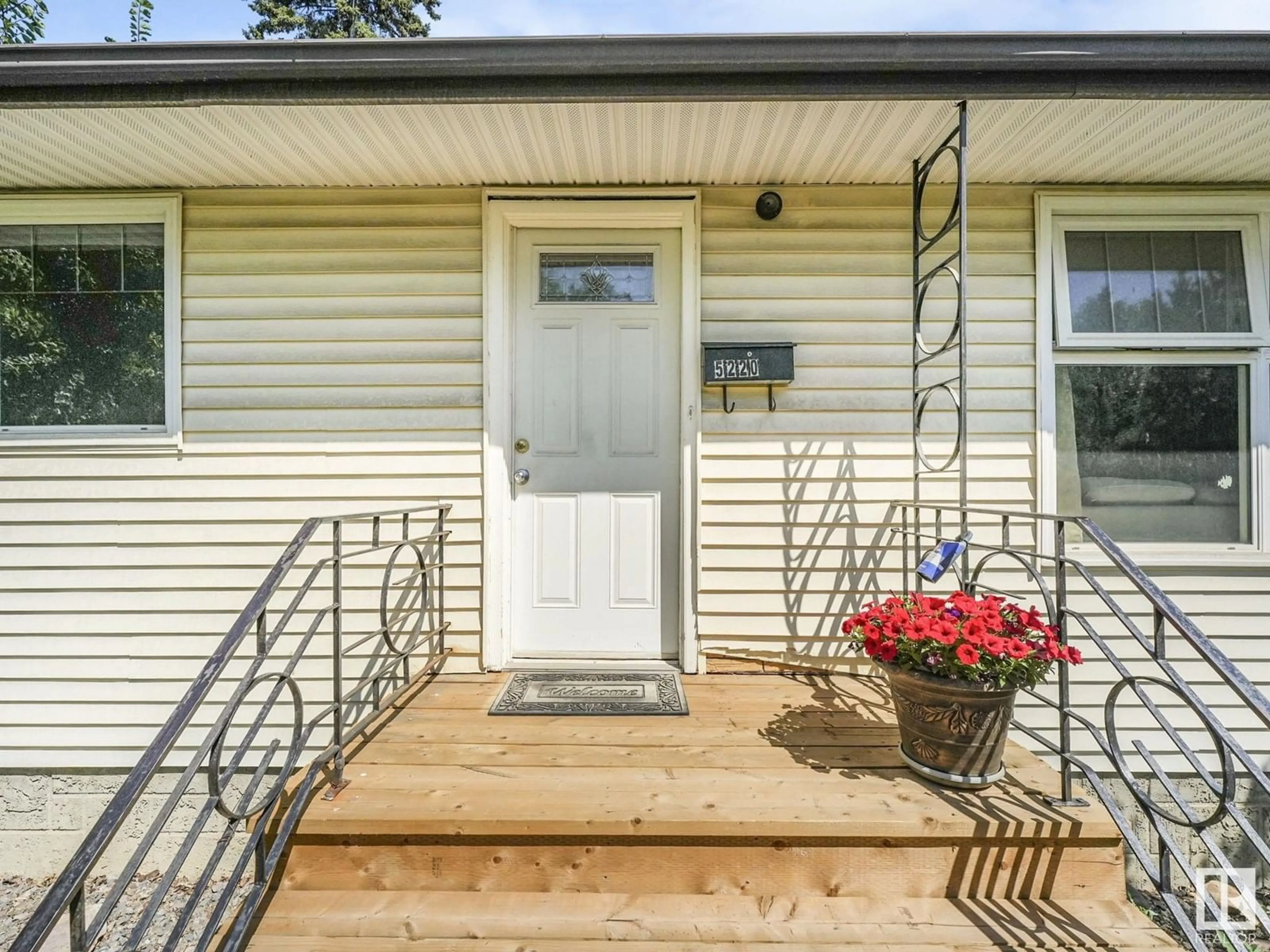 Home with vinyl exterior material, street for 5220 118 AV, Edmonton Alberta T5W1C3