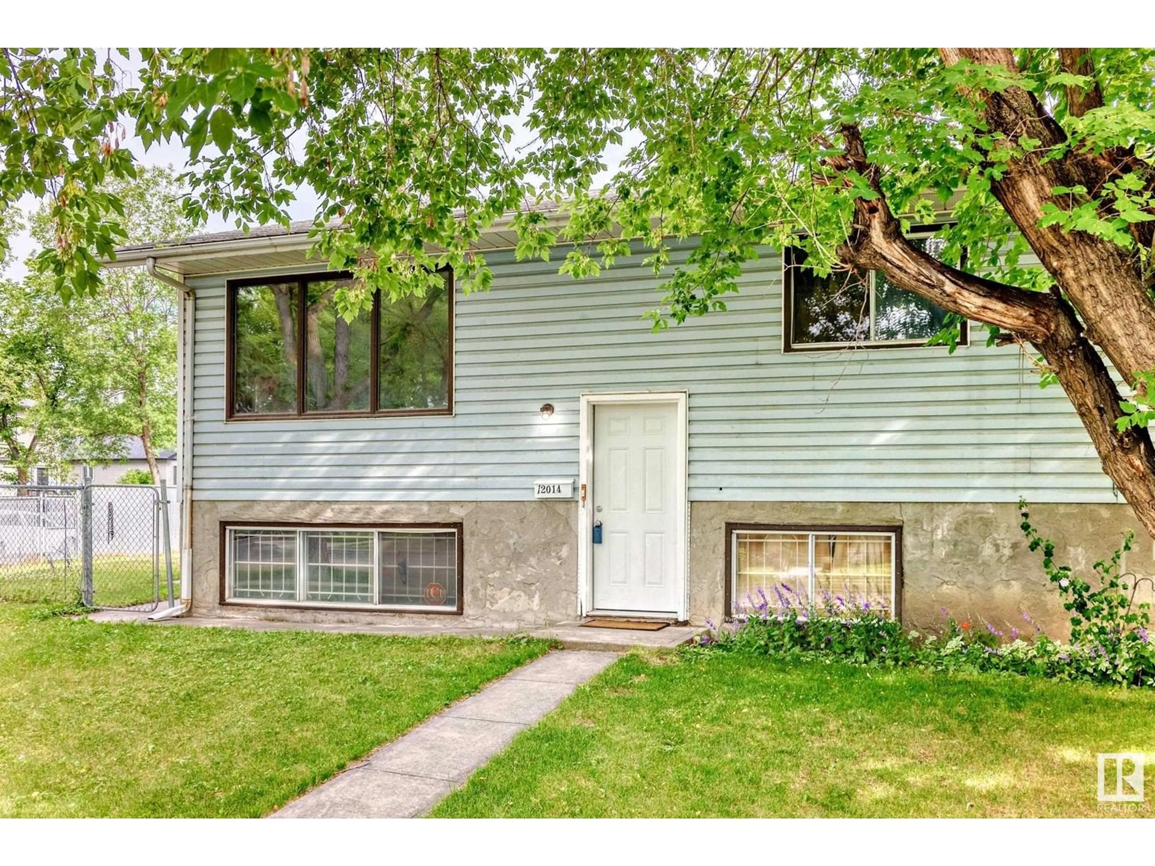 Home with vinyl exterior material, street for NW - 12014 128 AV, Edmonton Alberta T5E6J5