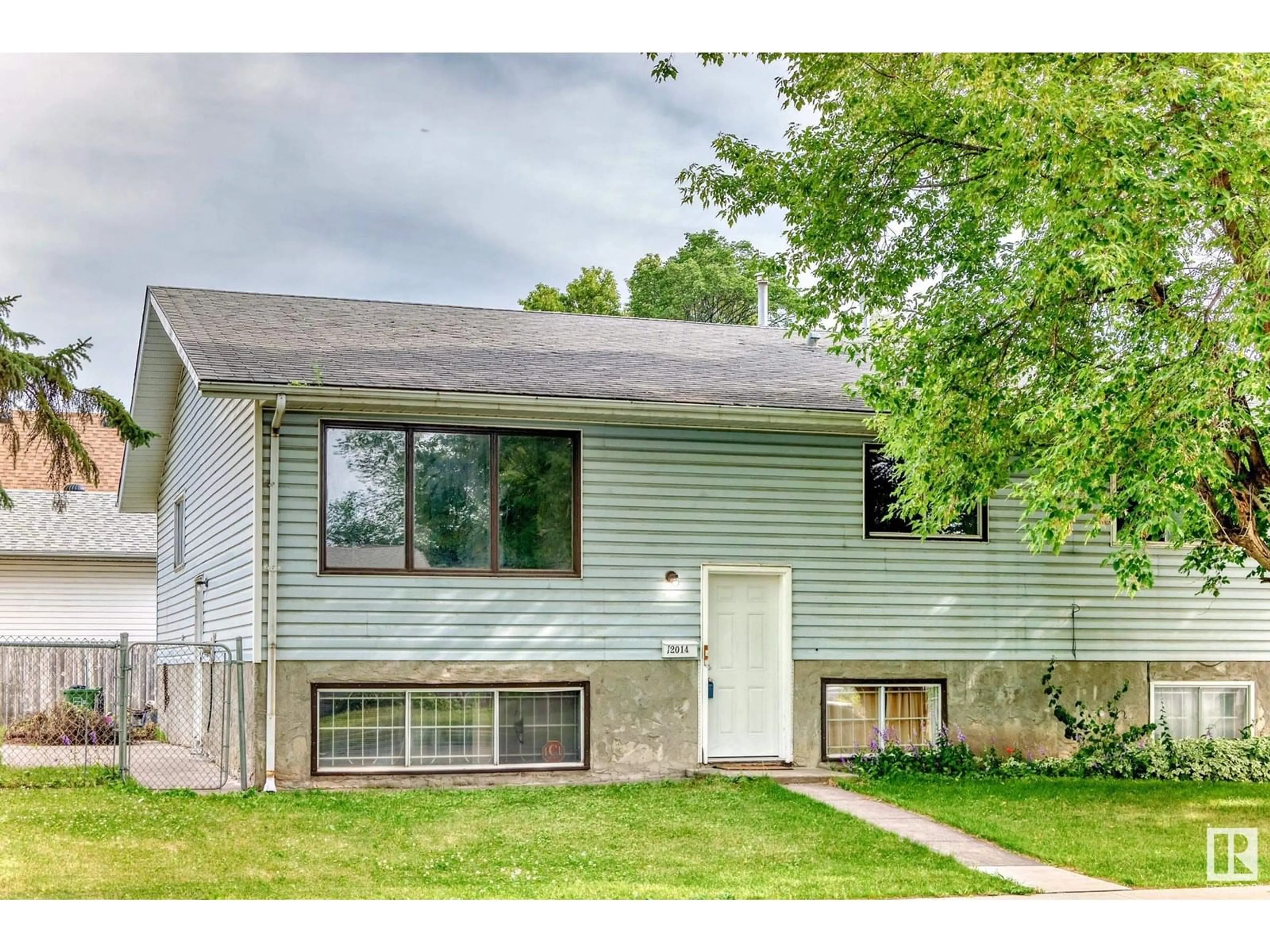 Home with vinyl exterior material, street for NW - 12014 128 AV, Edmonton Alberta T5E6J5
