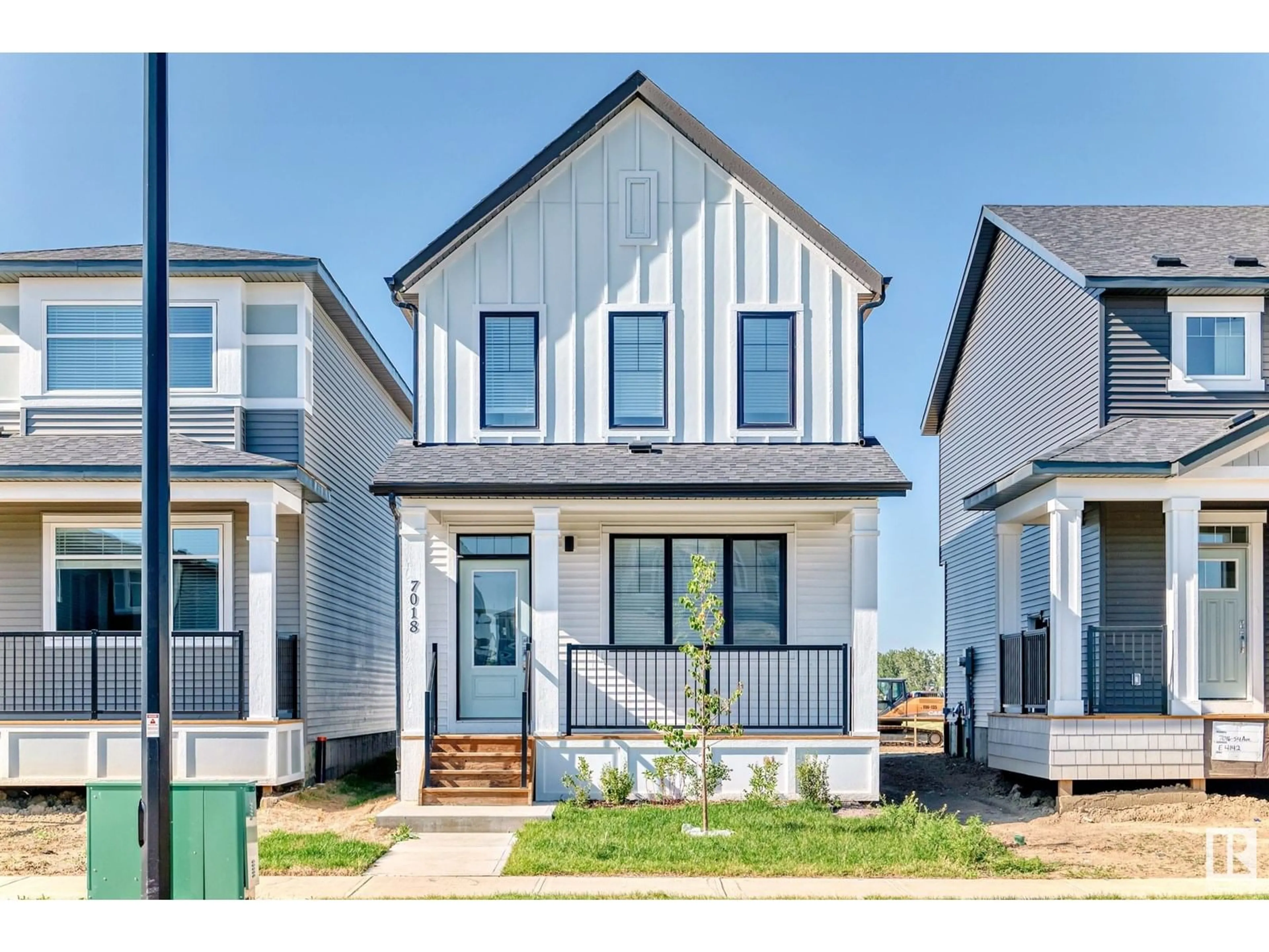 Home with vinyl exterior material, street for 7018 54 AV, Beaumont Alberta T6M1M7