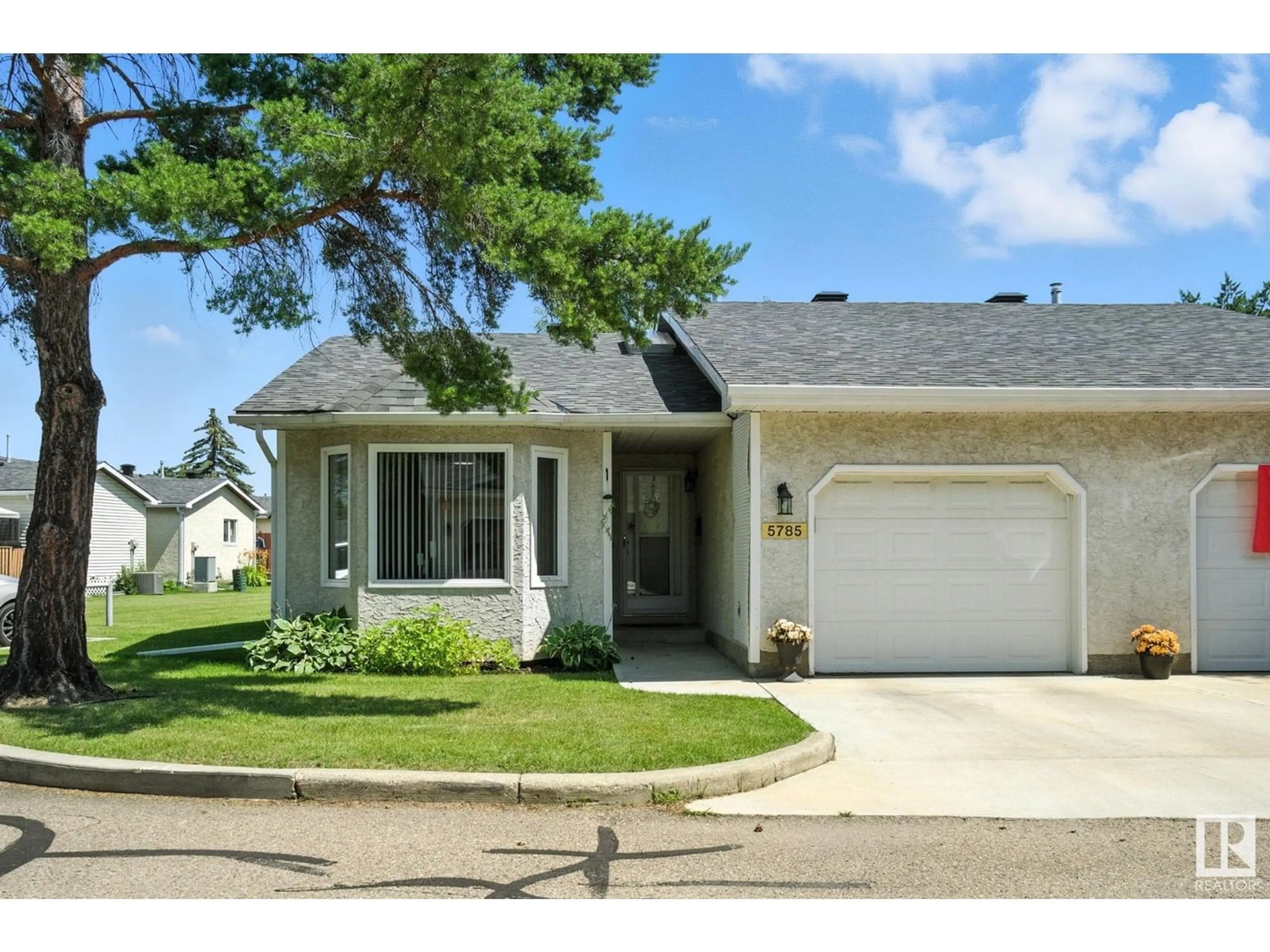 Home with vinyl exterior material, street for NW - 5785 189 ST, Edmonton Alberta T6M2G9