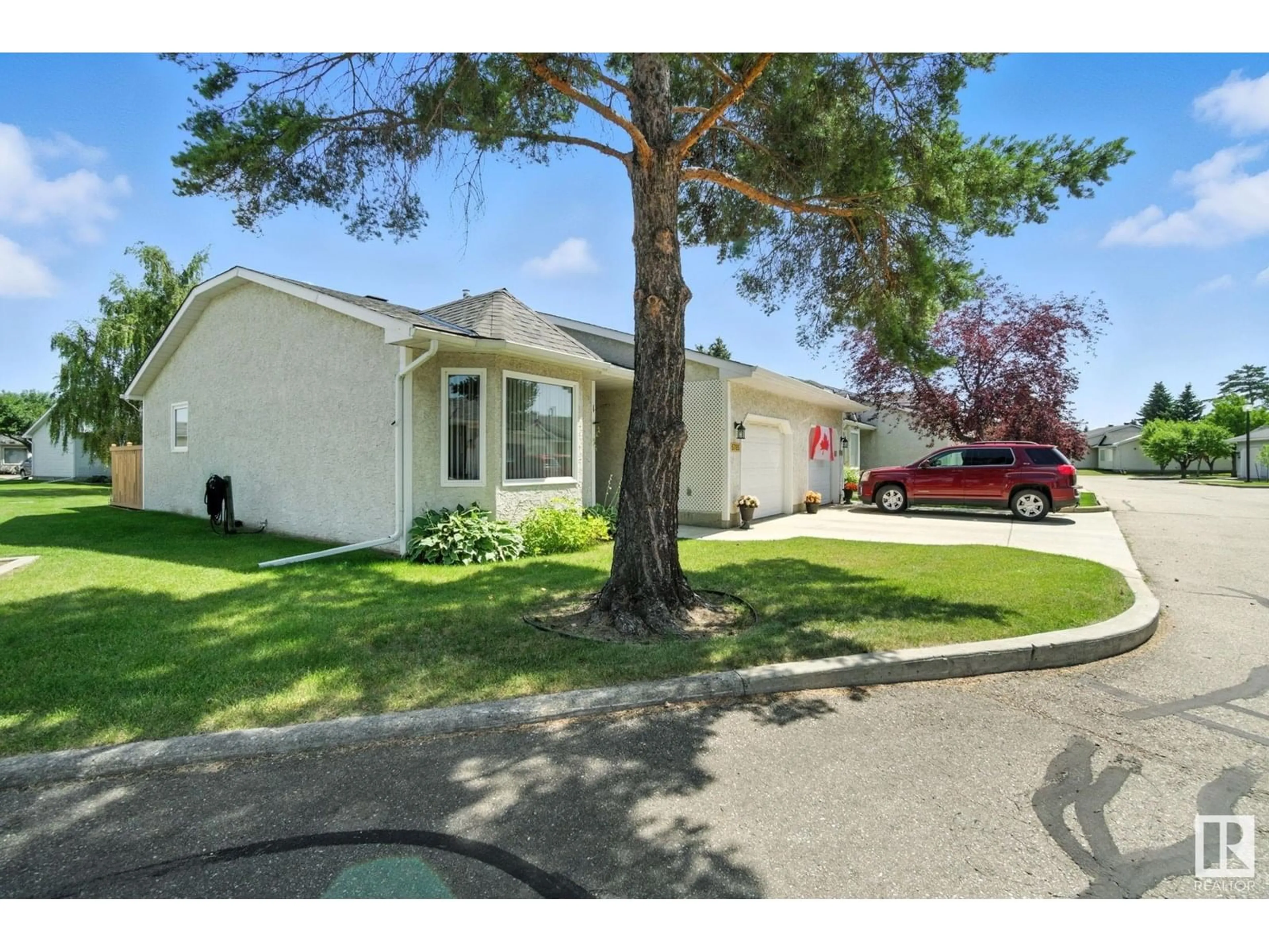 Home with vinyl exterior material, street for NW - 5785 189 ST, Edmonton Alberta T6M2G9