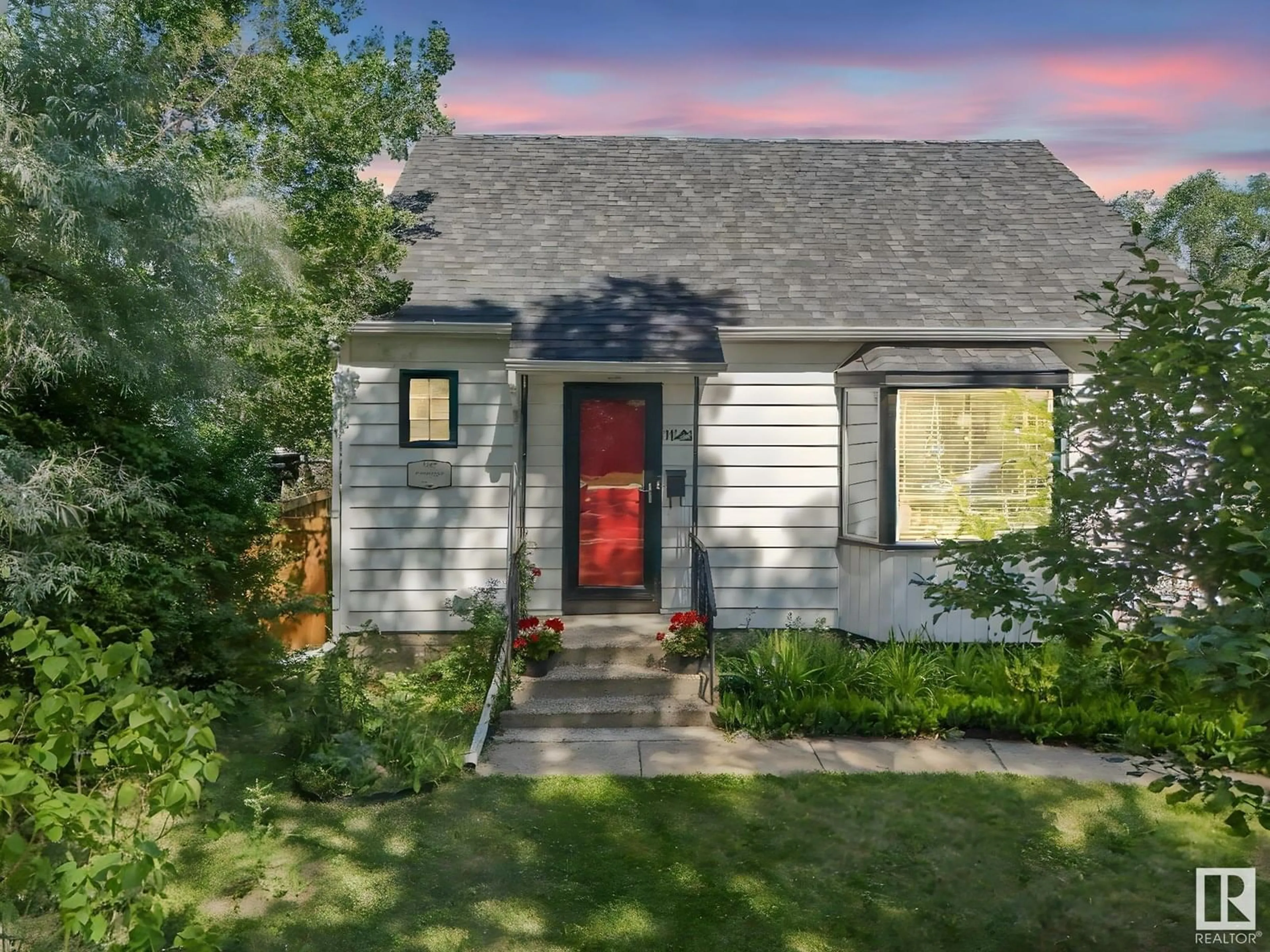 Home with vinyl exterior material, street for 11421 71 ST, Edmonton Alberta T5B1V8