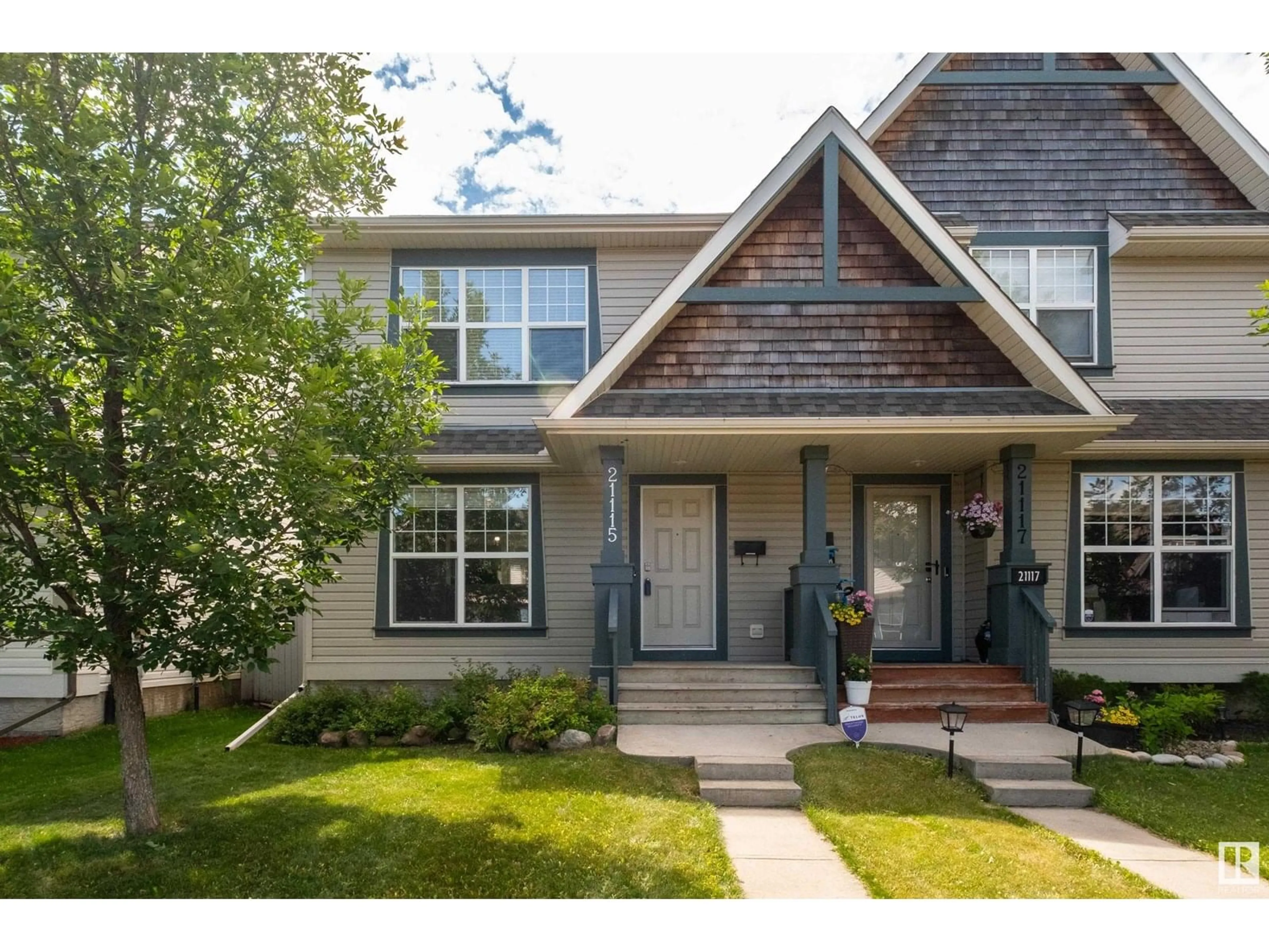 Home with vinyl exterior material, street for NW - 21115 60 AV, Edmonton Alberta T6M0H7