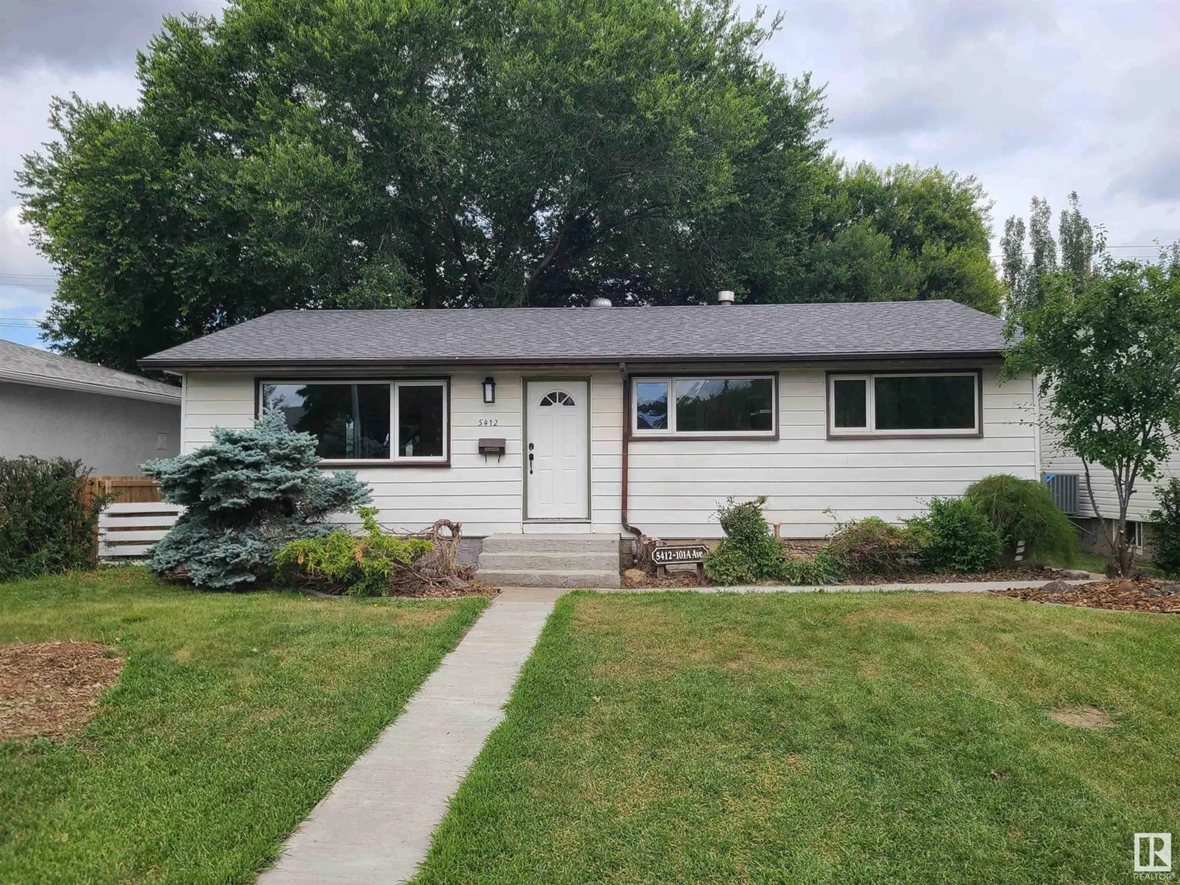 Home with vinyl exterior material, street for 5412 101A AV, Edmonton Alberta T6A0L8