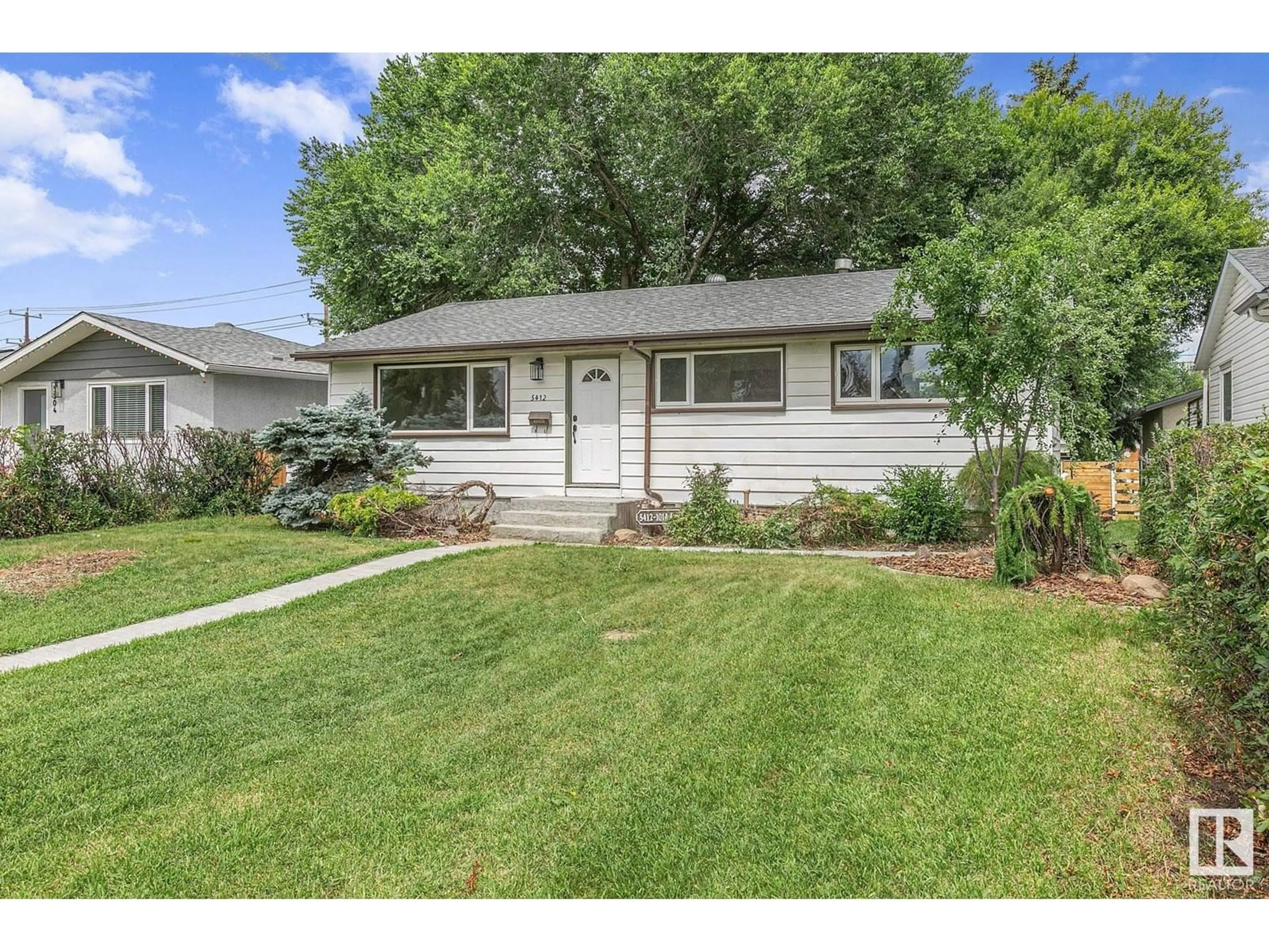 Home with vinyl exterior material, street for 5412 101A AV, Edmonton Alberta T6A0L8