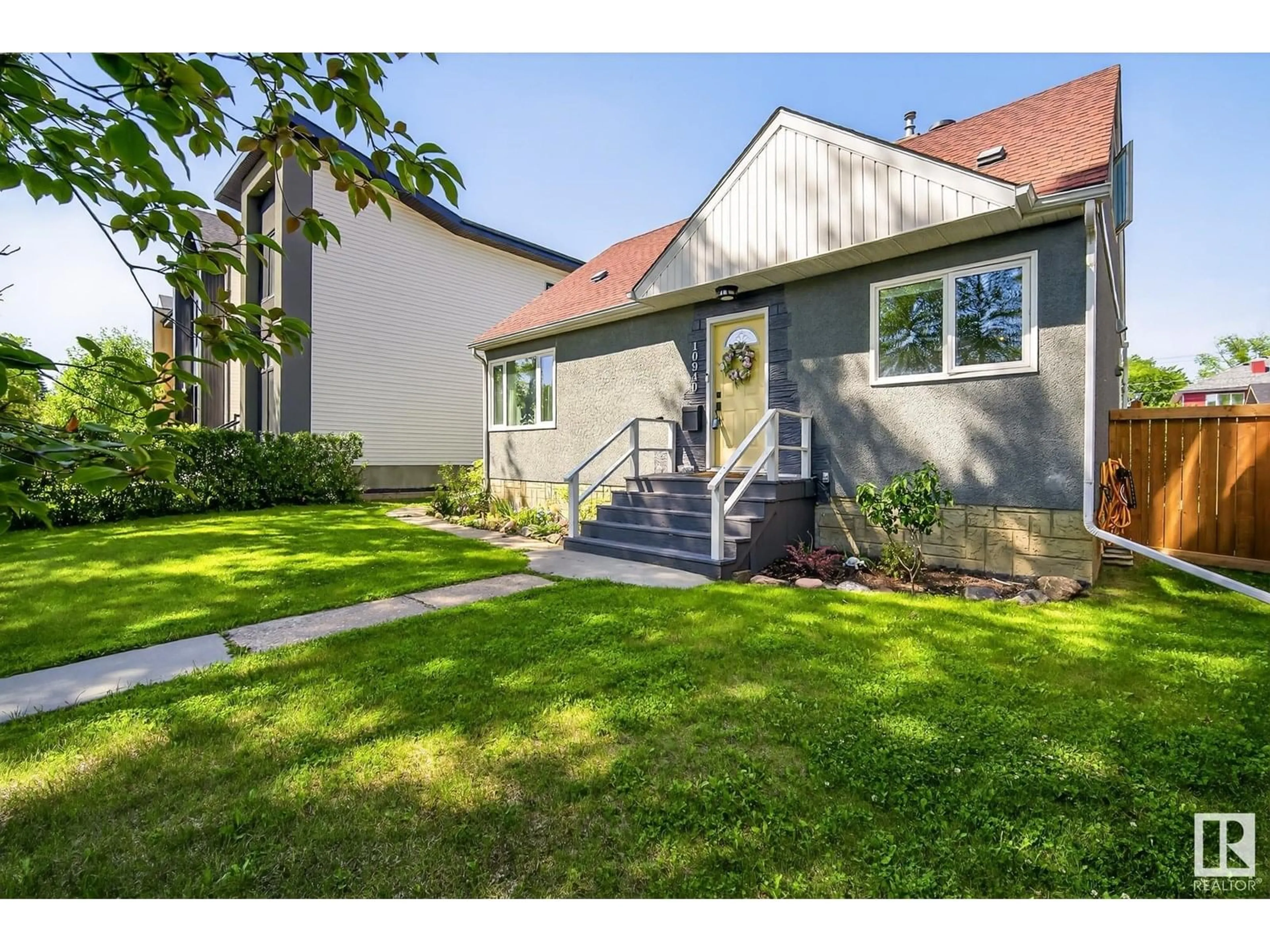 Home with vinyl exterior material, street for NW - 10940 130 ST, Edmonton Alberta T5M0Z3