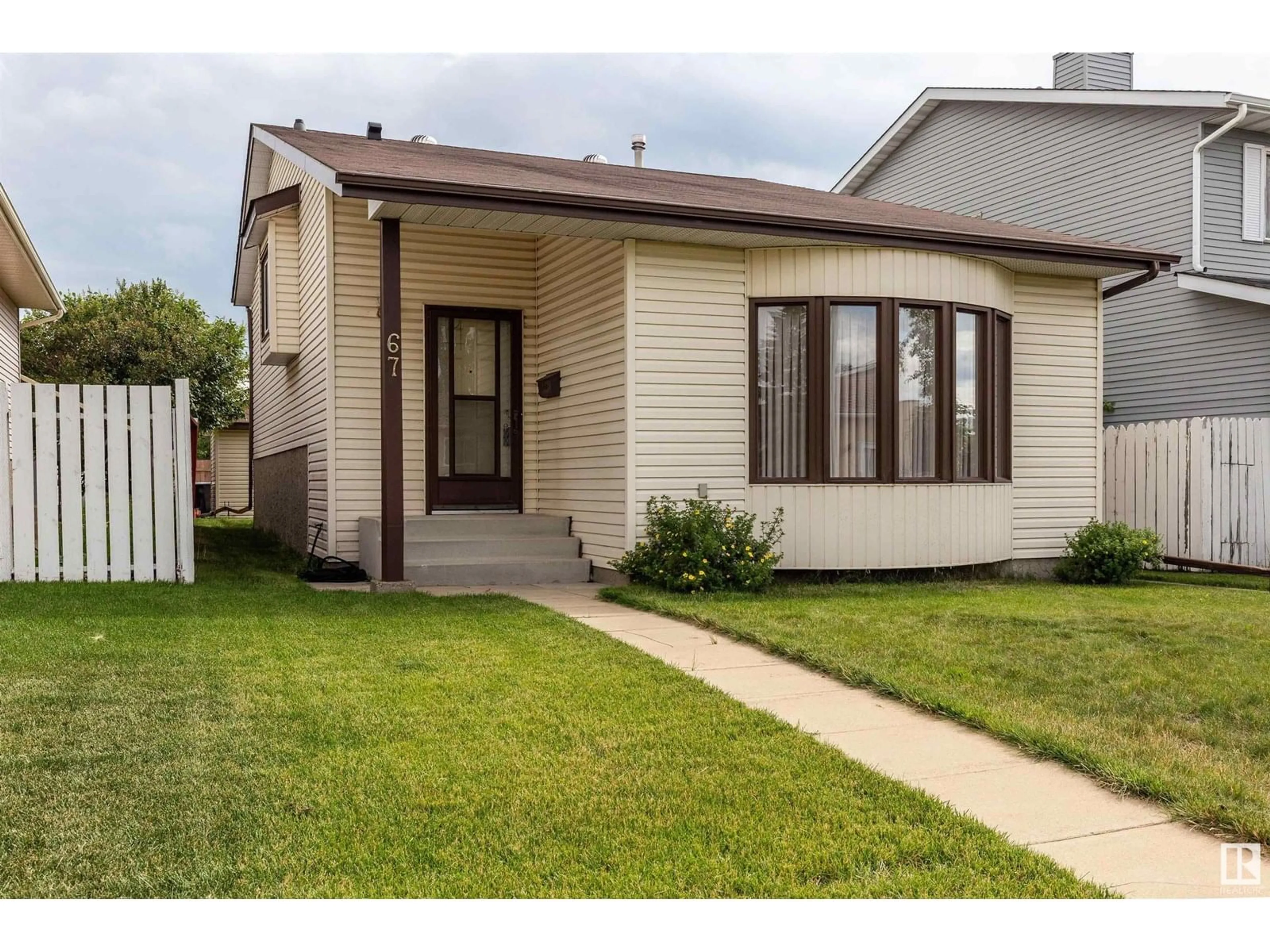 Home with vinyl exterior material, street for 67 KINISKI CR, Edmonton Alberta T6L5E3