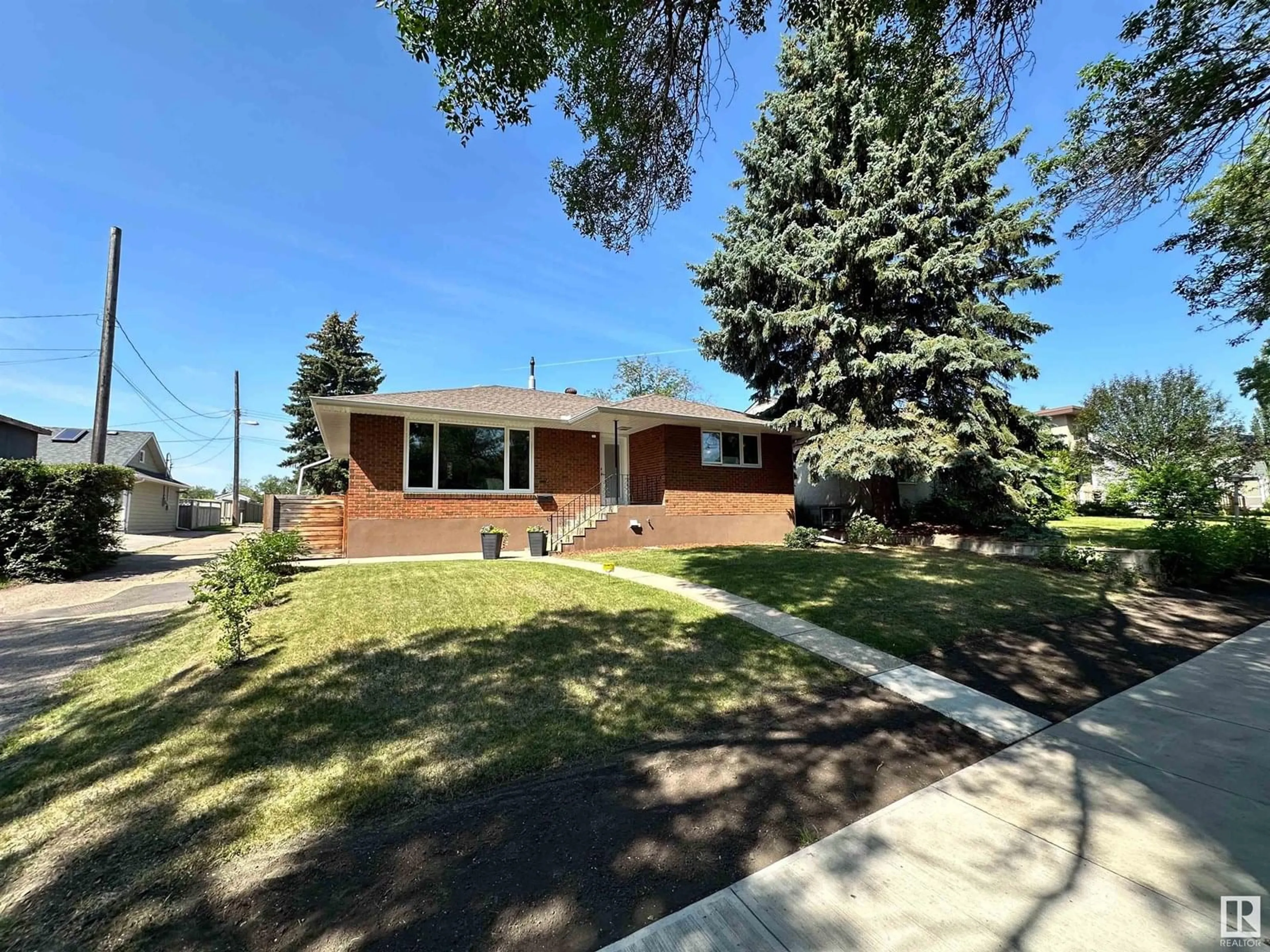 Home with brick exterior material, street for NW - 11116 69 ST, Edmonton Alberta T5B1R4