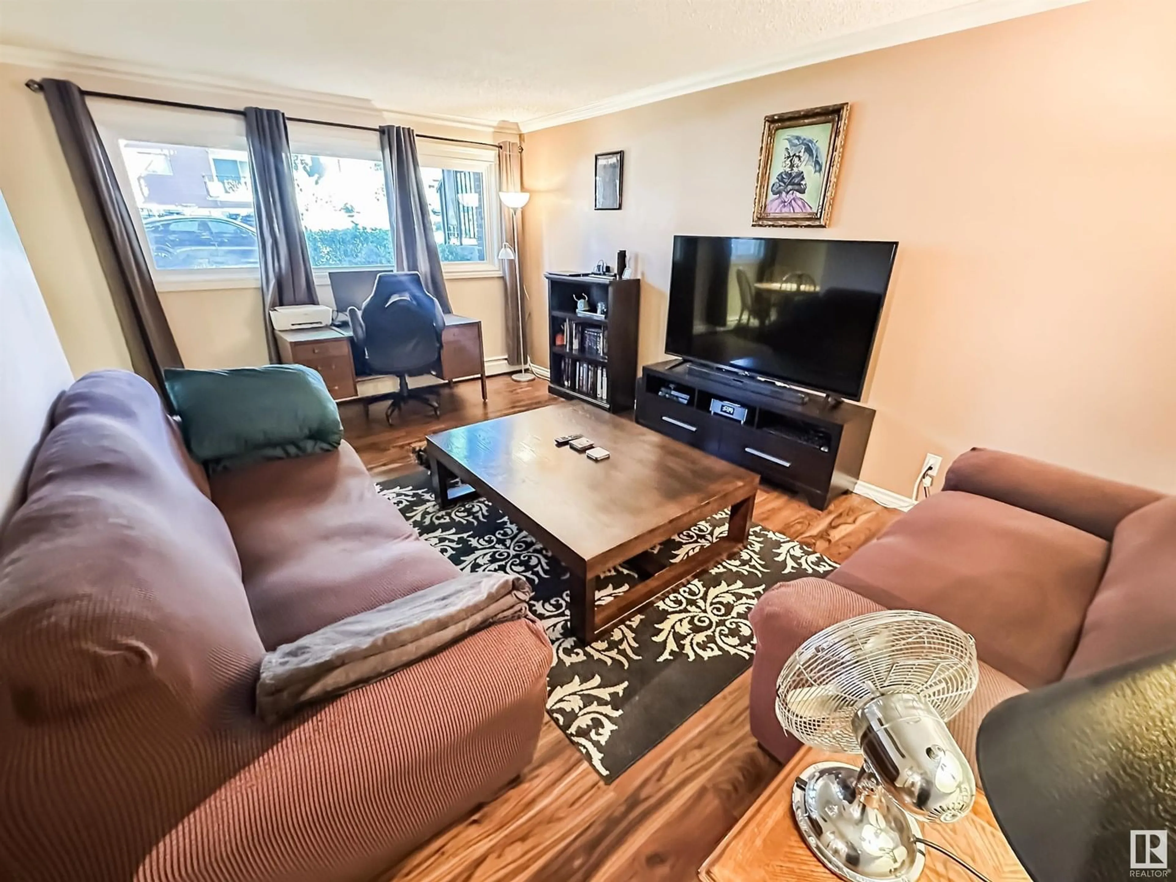 Living room with furniture, wood/laminate floor for #101 - 10555 83 AV, Edmonton Alberta T6E2E1