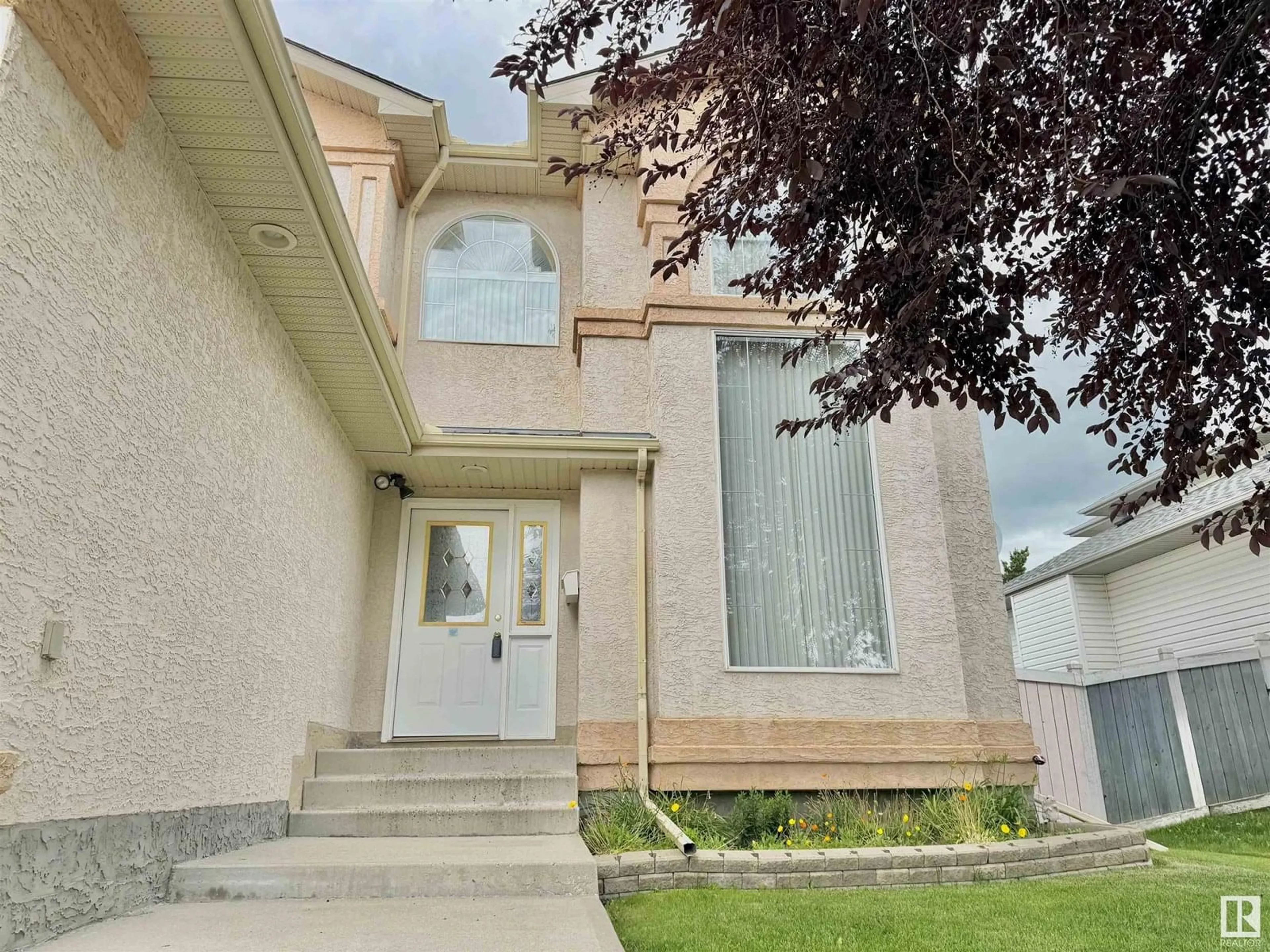 Home with vinyl exterior material, street for 8416 160A AV, Edmonton Alberta T5Z3K2