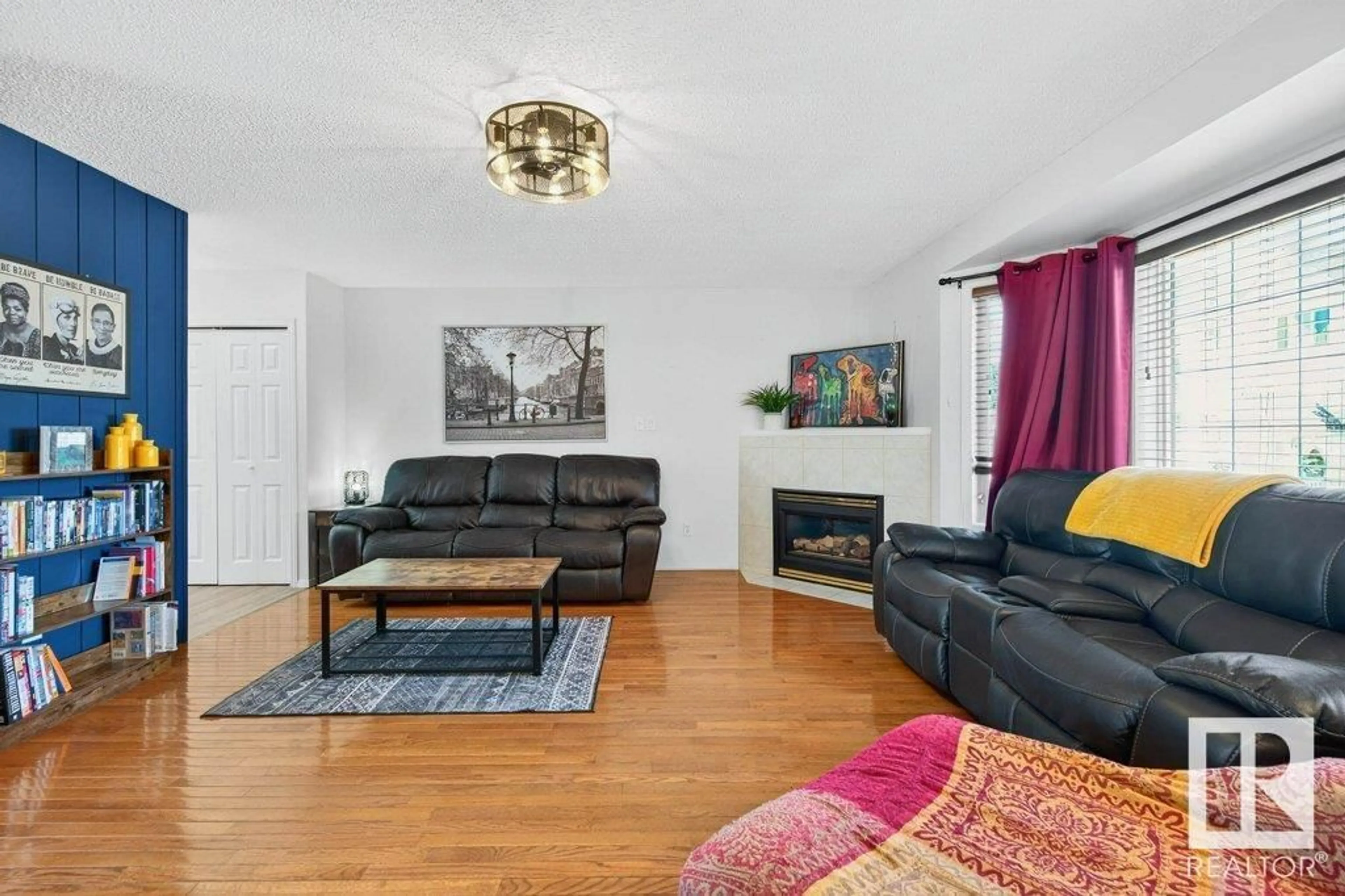 Living room with furniture, wood/laminate floor for 8329 160 AV, Edmonton Alberta T5Z3G9