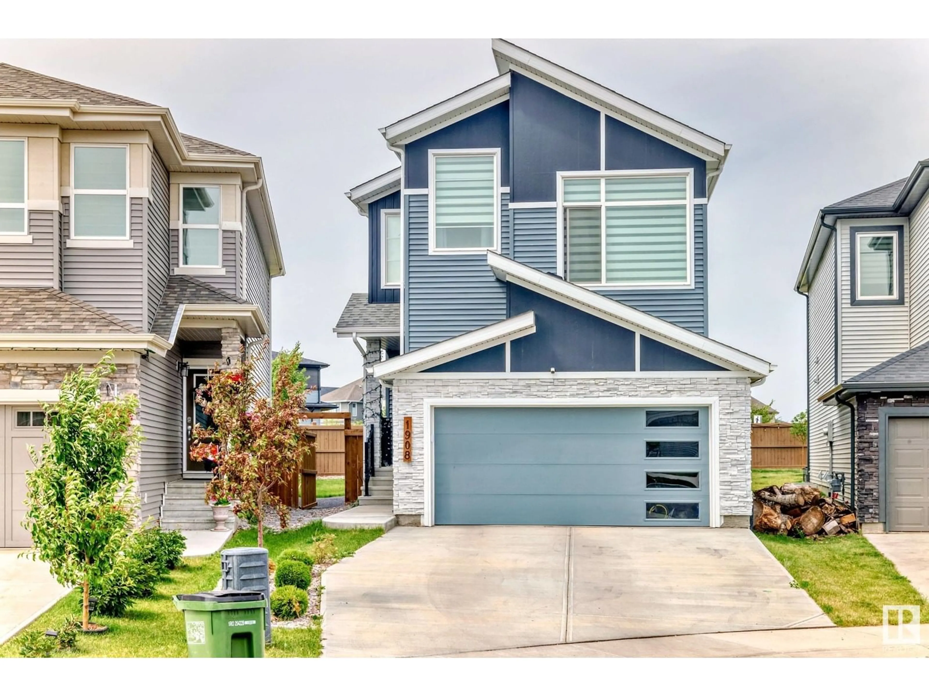 Home with vinyl exterior material, street for SW - 1908 160 ST, Edmonton Alberta T6W4X6