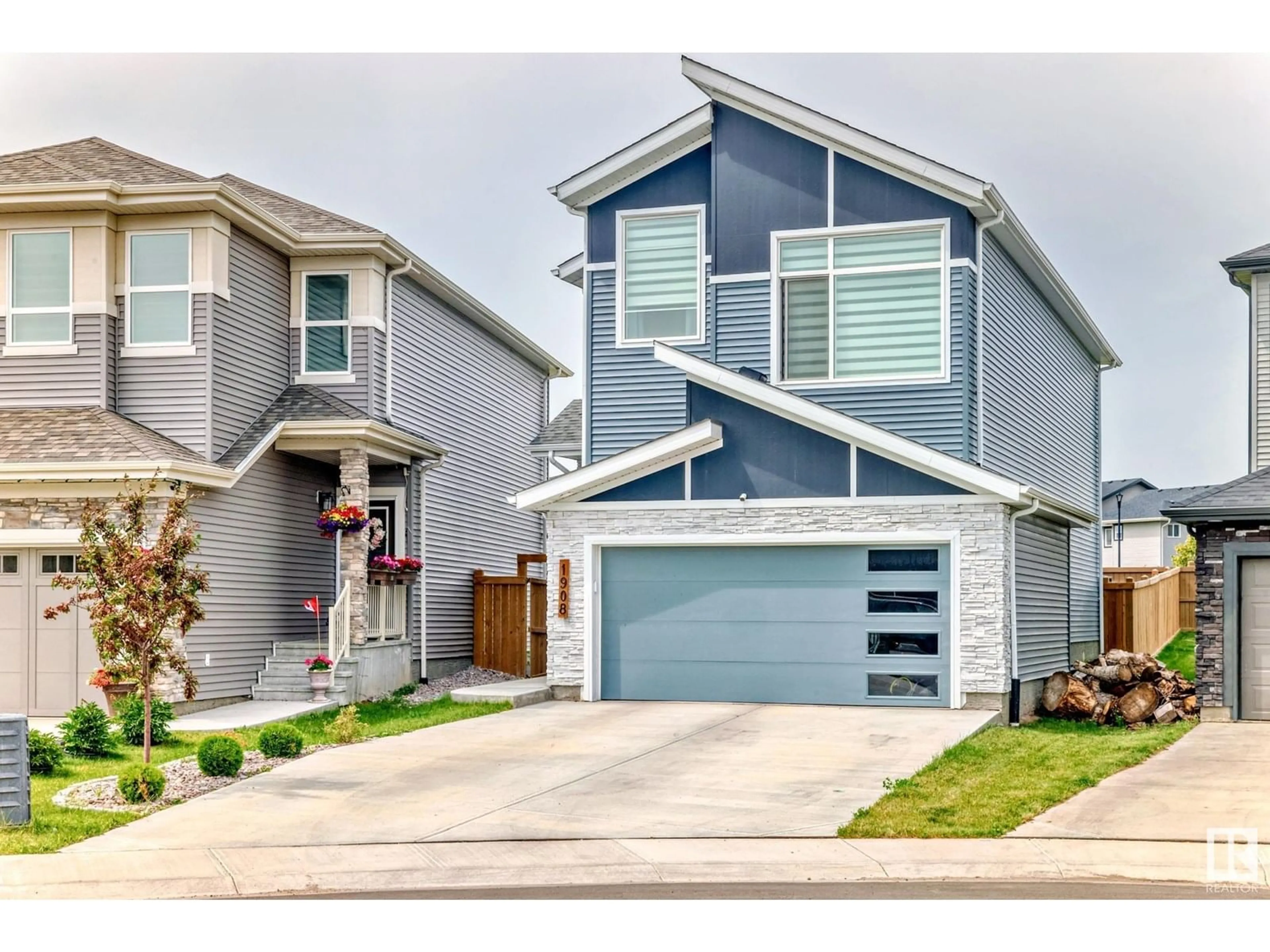 Home with vinyl exterior material, street for SW - 1908 160 ST, Edmonton Alberta T6W4X6