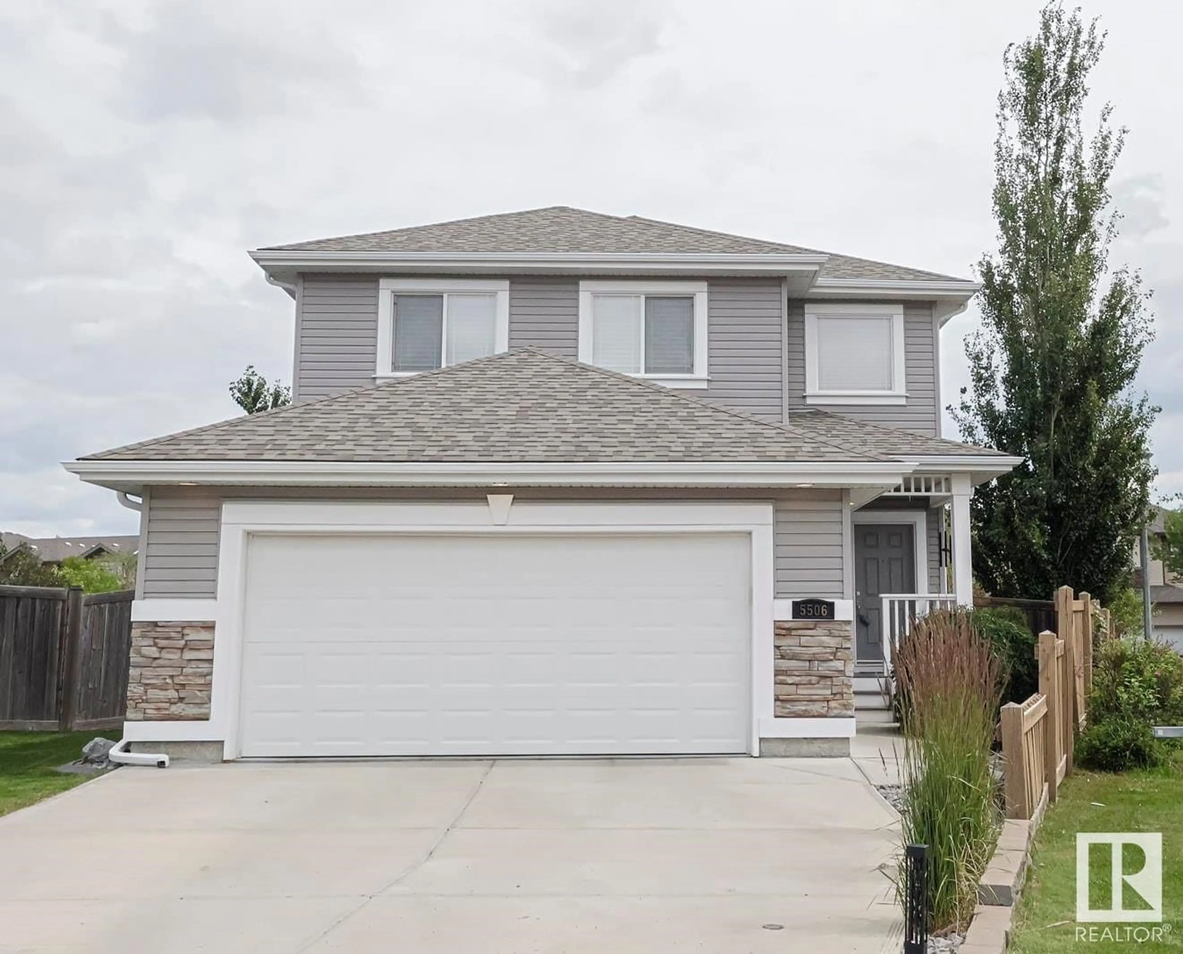 Home with vinyl exterior material, street for NW - 5506 168A AV, Edmonton Alberta T5Y0K4