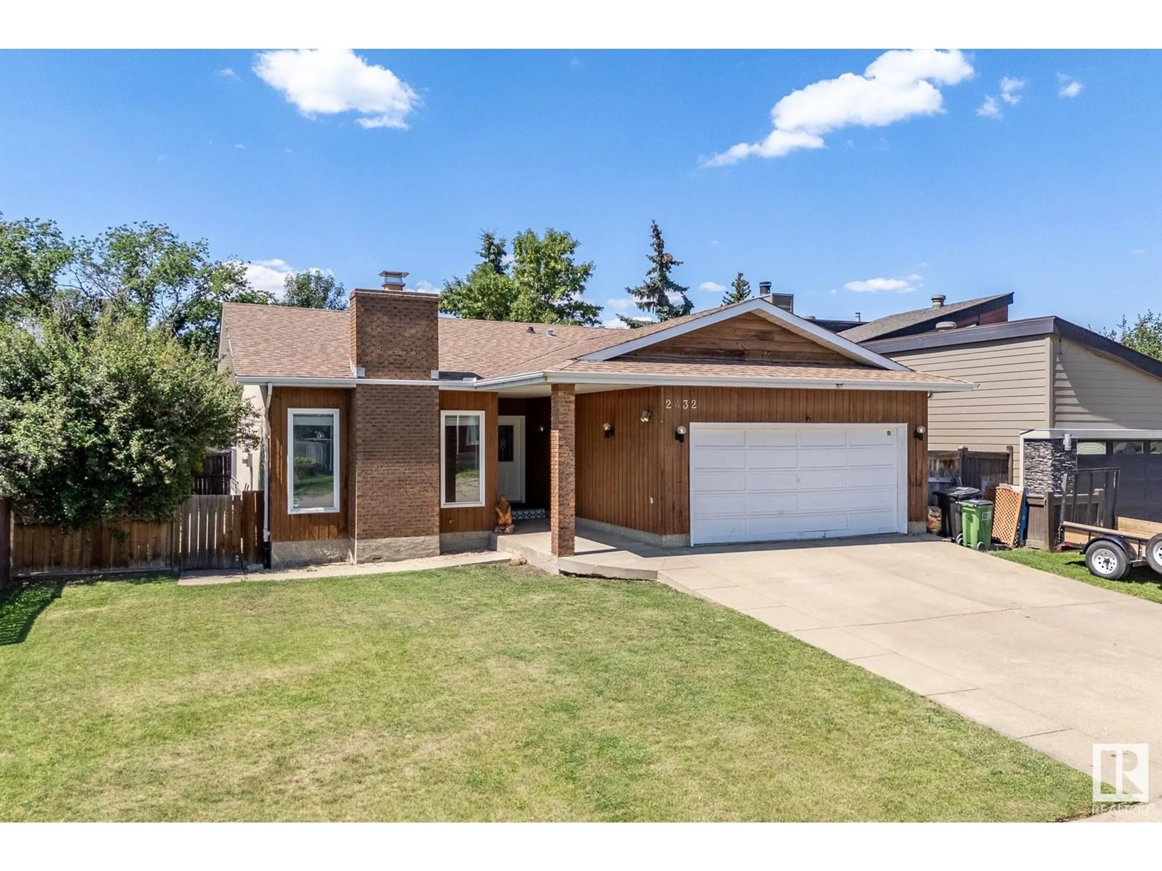 Home with brick exterior material, street for 2432 106 ST, Edmonton Alberta T6J4K5