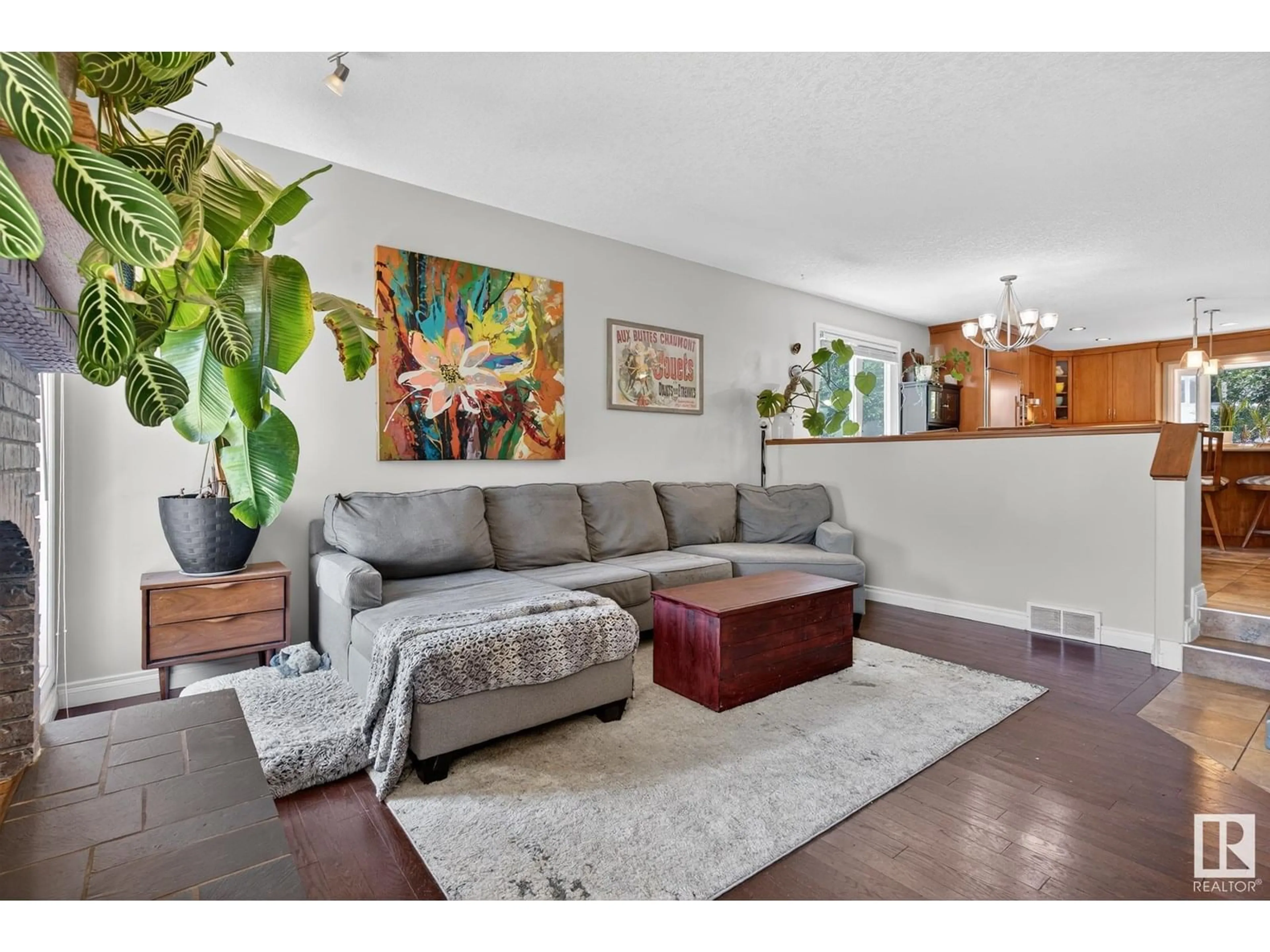 Living room with furniture, wood/laminate floor for 2432 106 ST, Edmonton Alberta T6J4K5