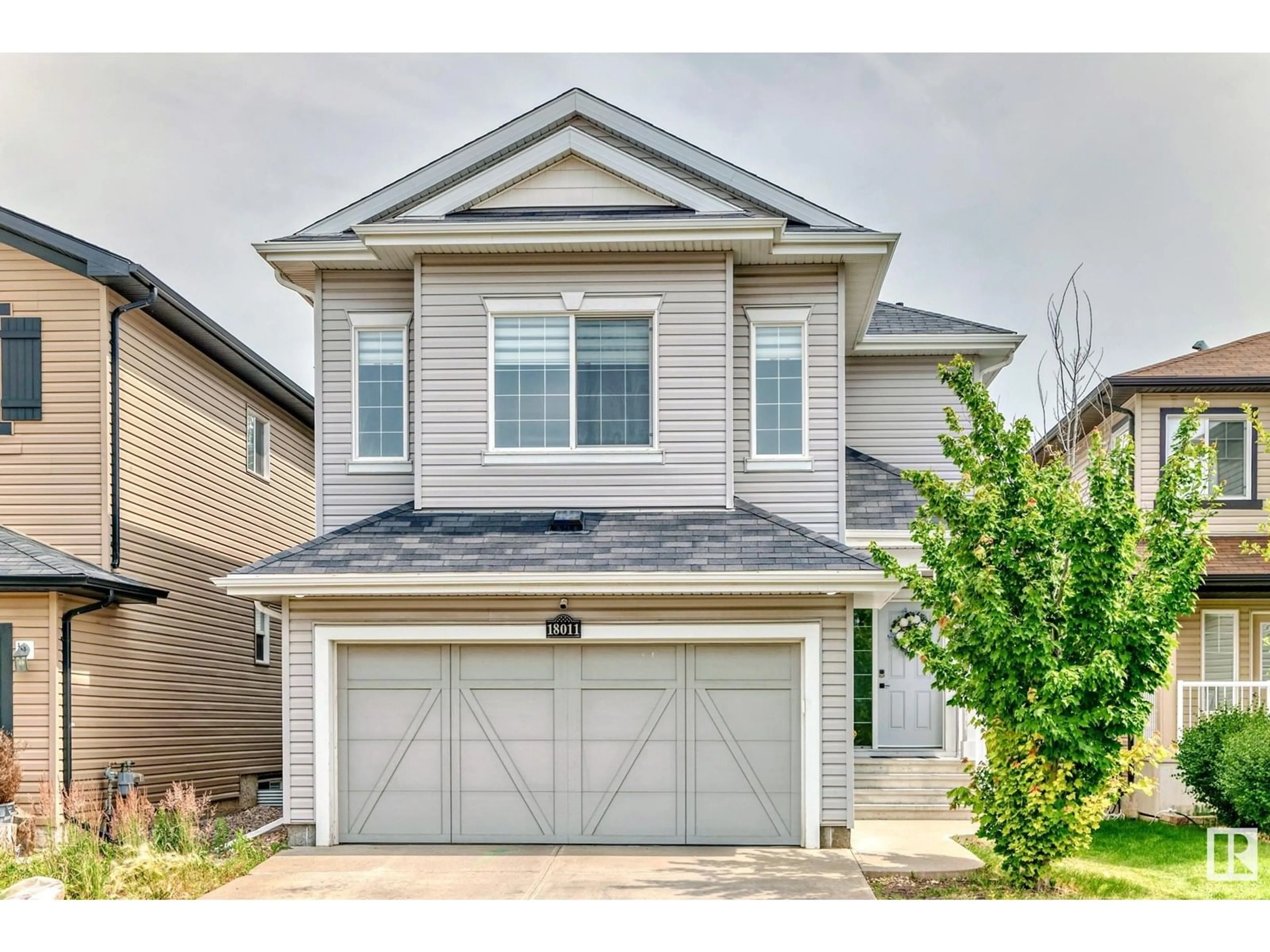 Home with vinyl exterior material, street for 18011 84 ST, Edmonton Alberta T5Z0H7