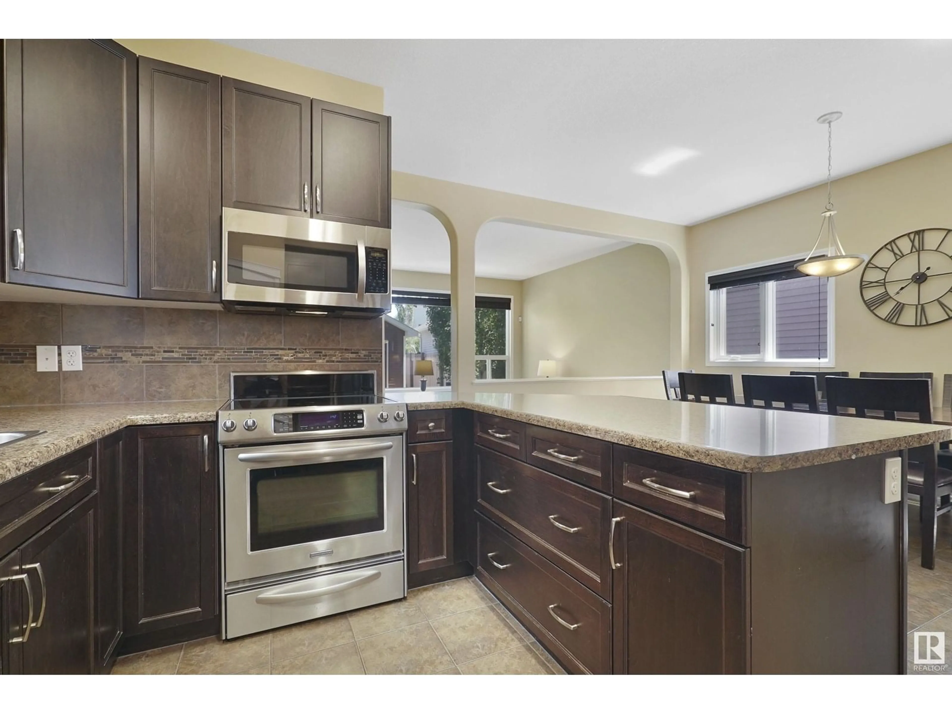 Open concept kitchen, ceramic/tile floor for 2035 74 ST, Edmonton Alberta T6X0V7