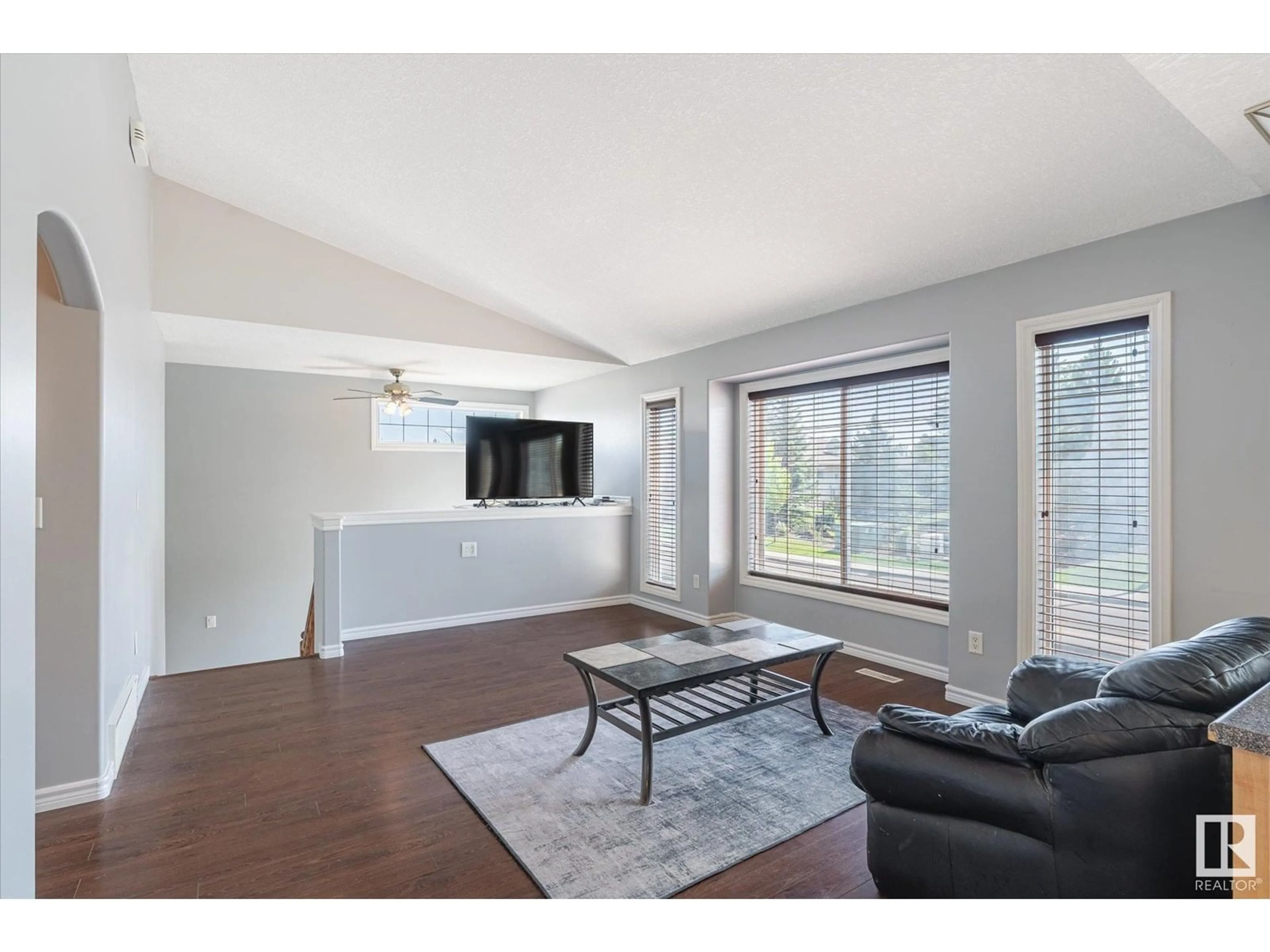 Living room with furniture, wood/laminate floor for 16204 51 ST, Edmonton Alberta T5Y3K2