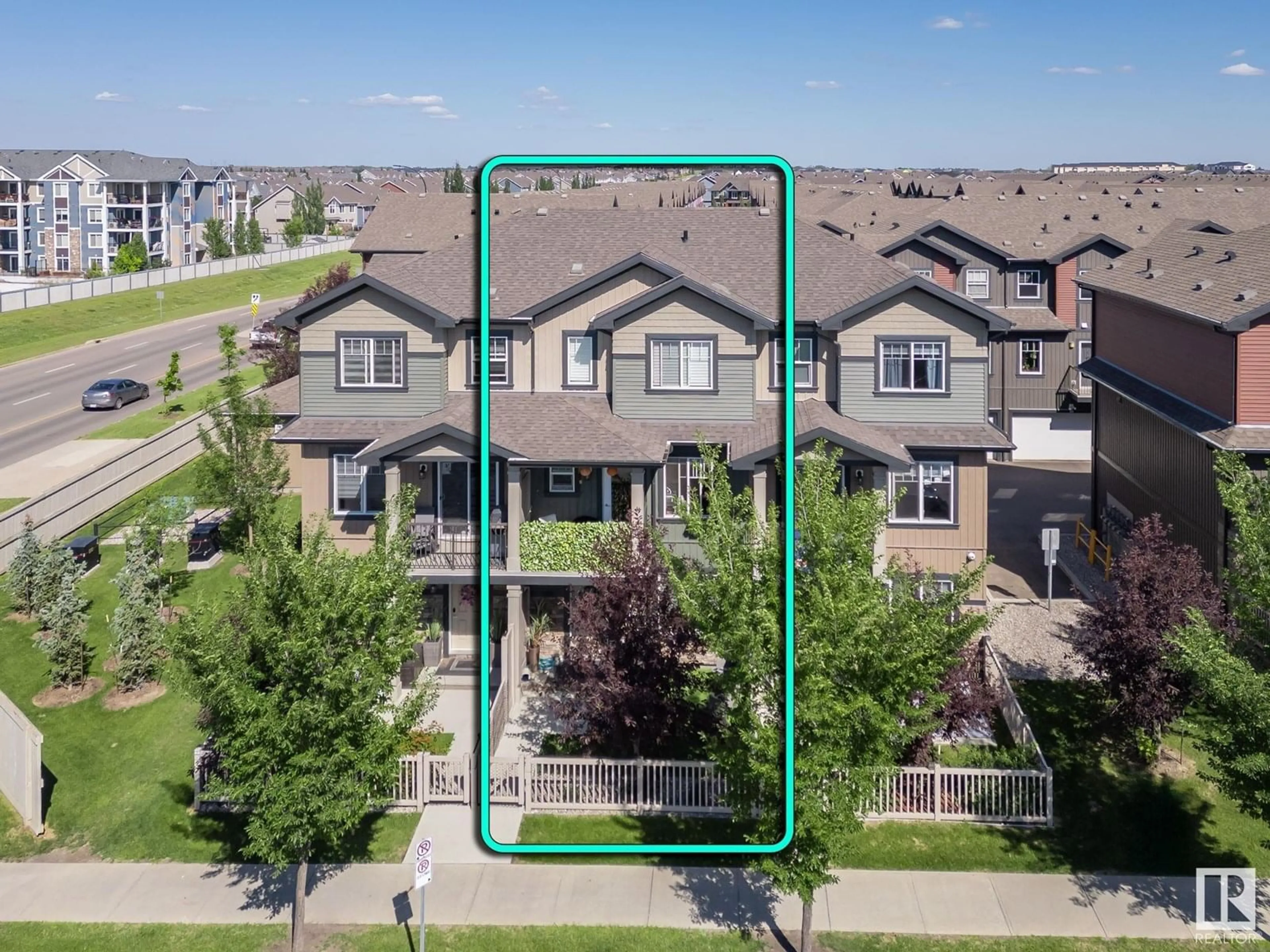A pic from outside/outdoor area/front of a property/back of a property/a pic from drone, street for #2 - 3305 ORCHARDS LINK LI SW, Edmonton Alberta T6X2H1
