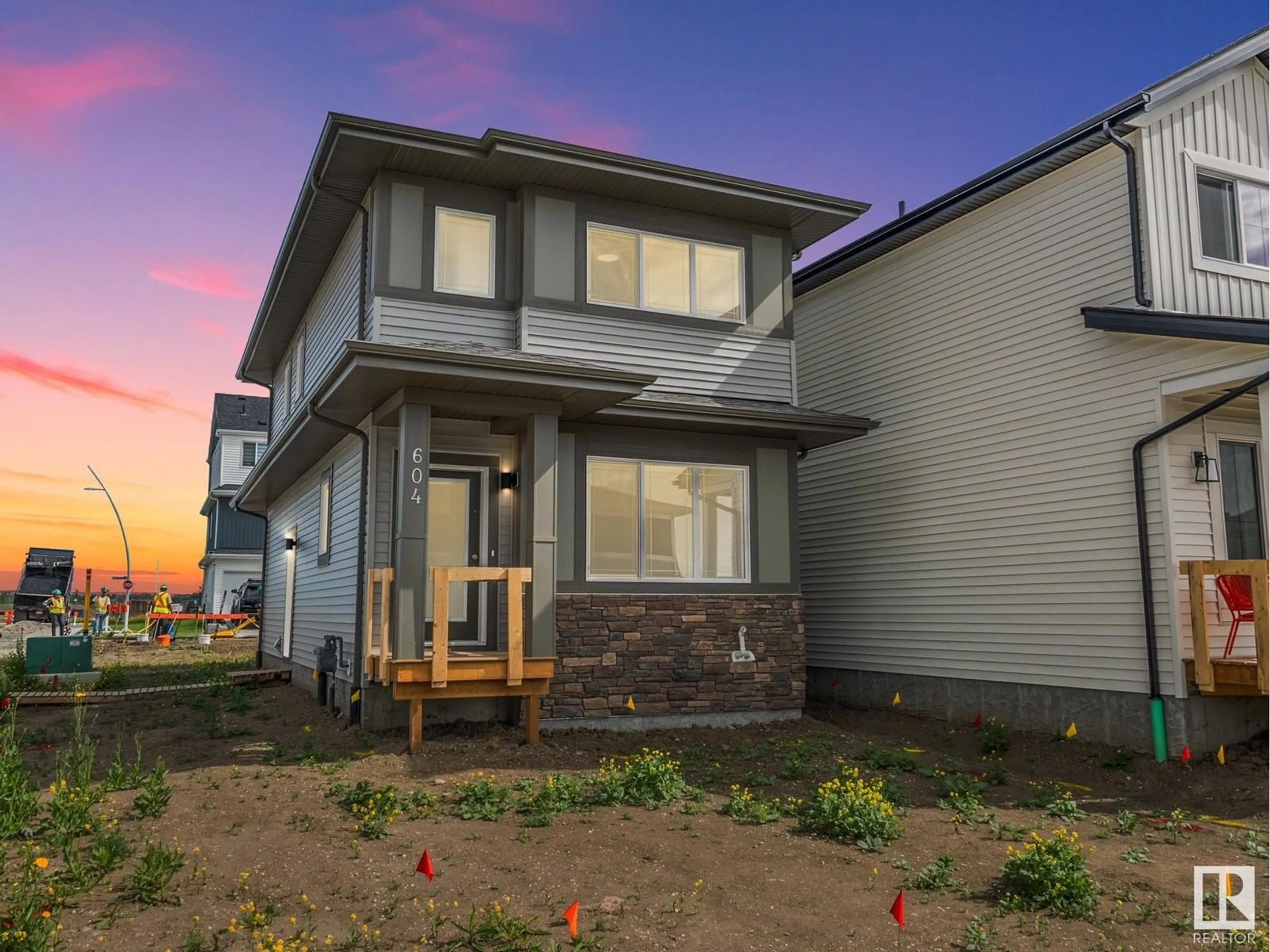 Home with vinyl exterior material, street for NE - 604 174 AV, Edmonton Alberta T5Y4G1