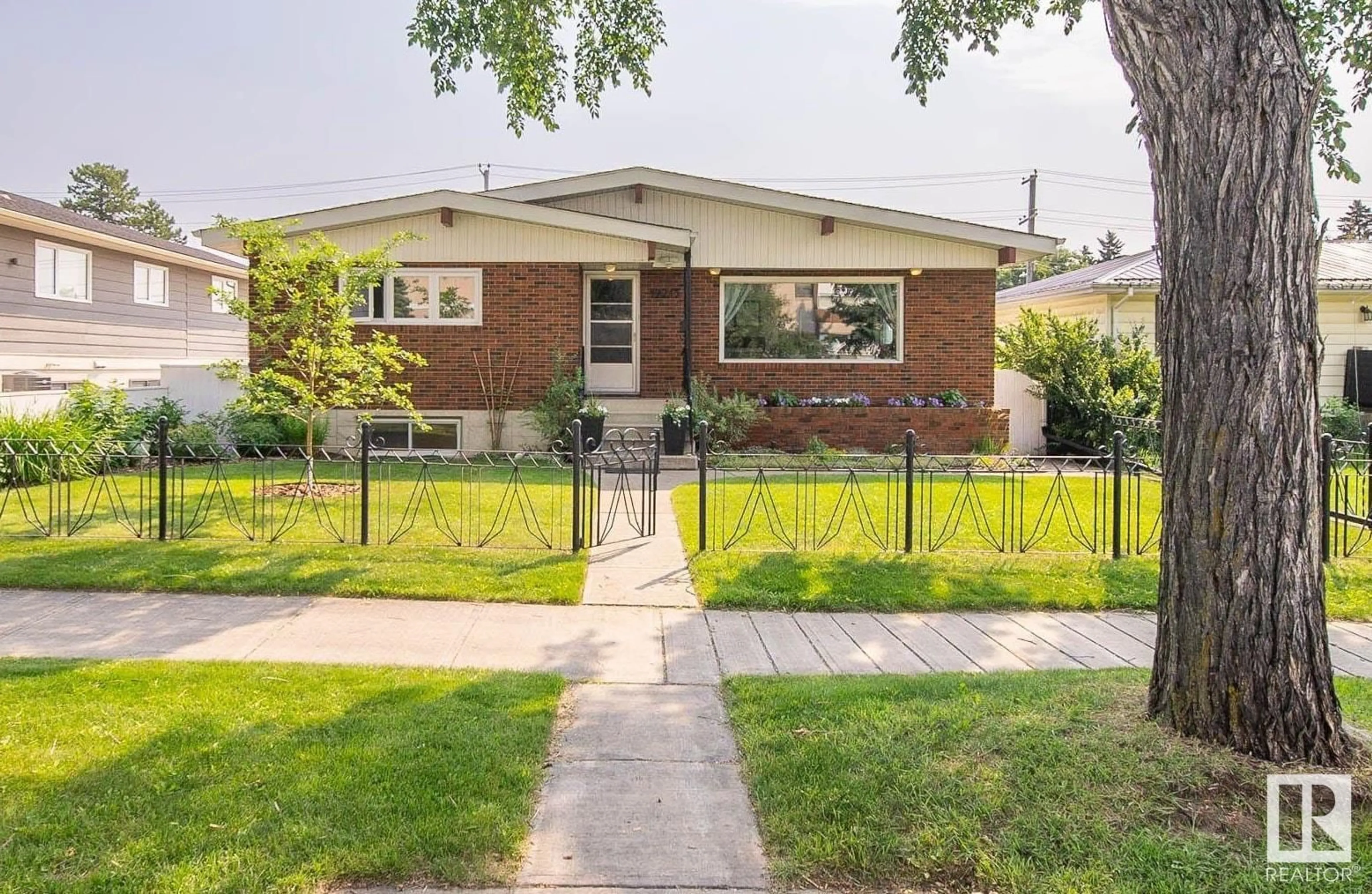 Home with brick exterior material, street for 12213 128 ST, Edmonton Alberta T5L1C6