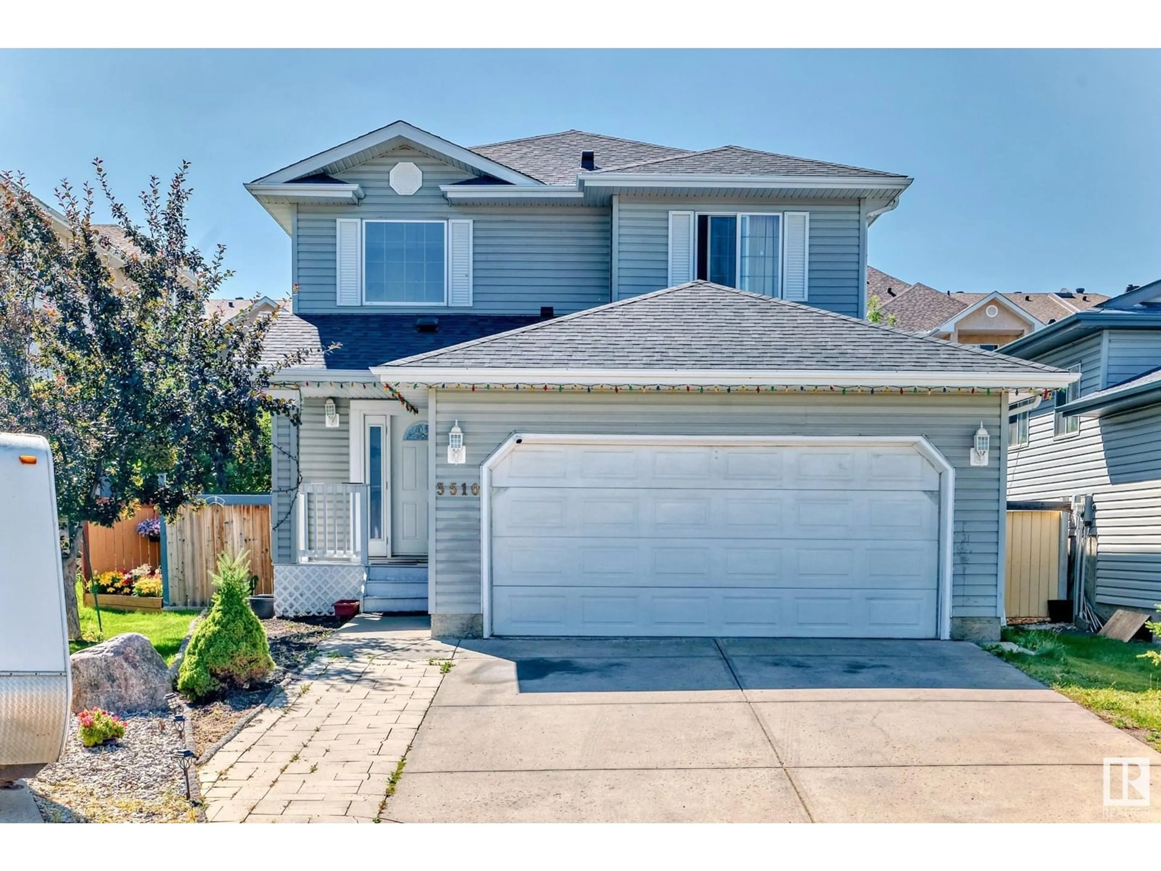 Home with vinyl exterior material, street for 3510 22 ST, Edmonton Alberta T6T1W2