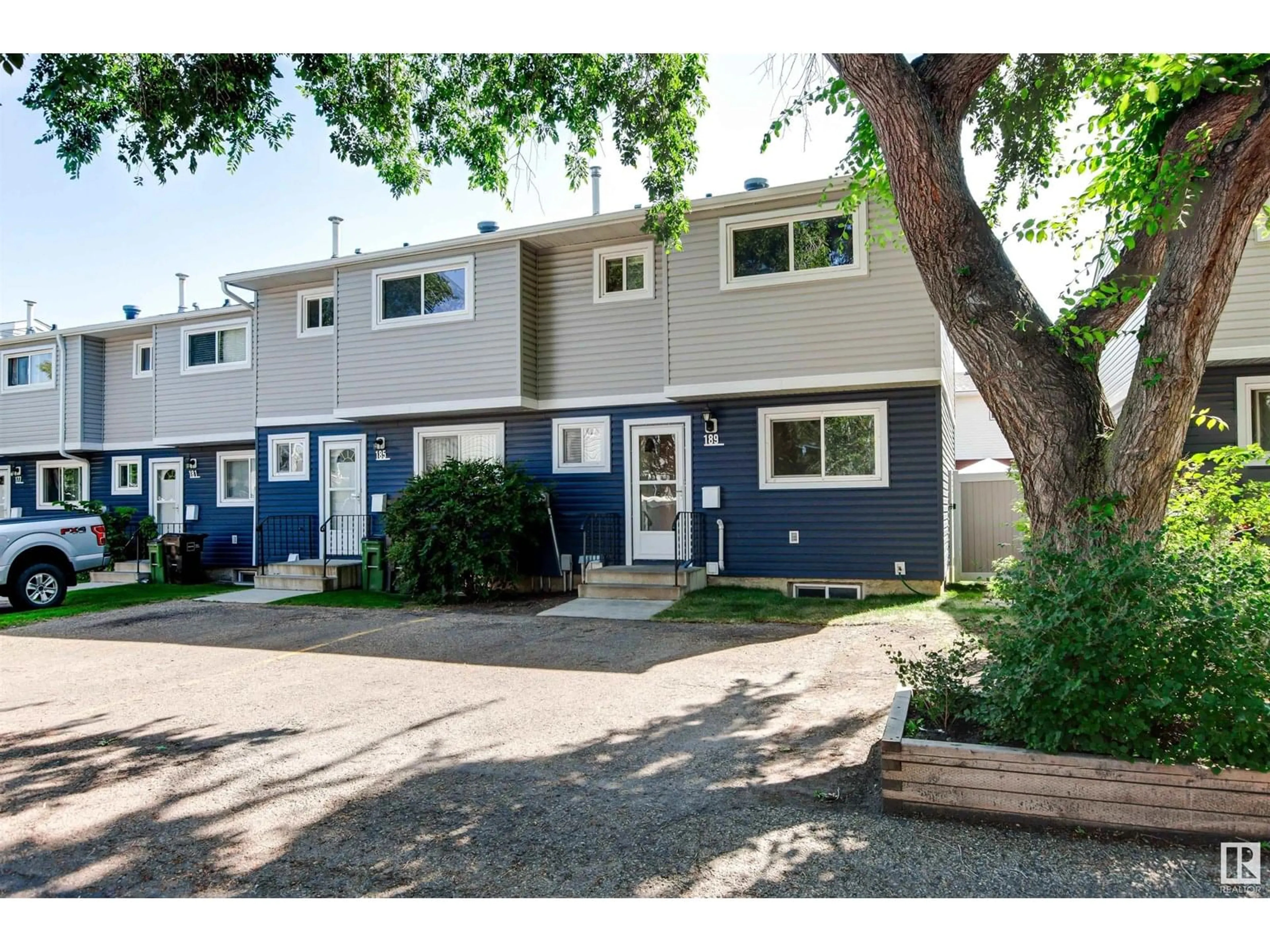 Home with vinyl exterior material, street for 189 HABITAT CR, Edmonton Alberta T5A3K8