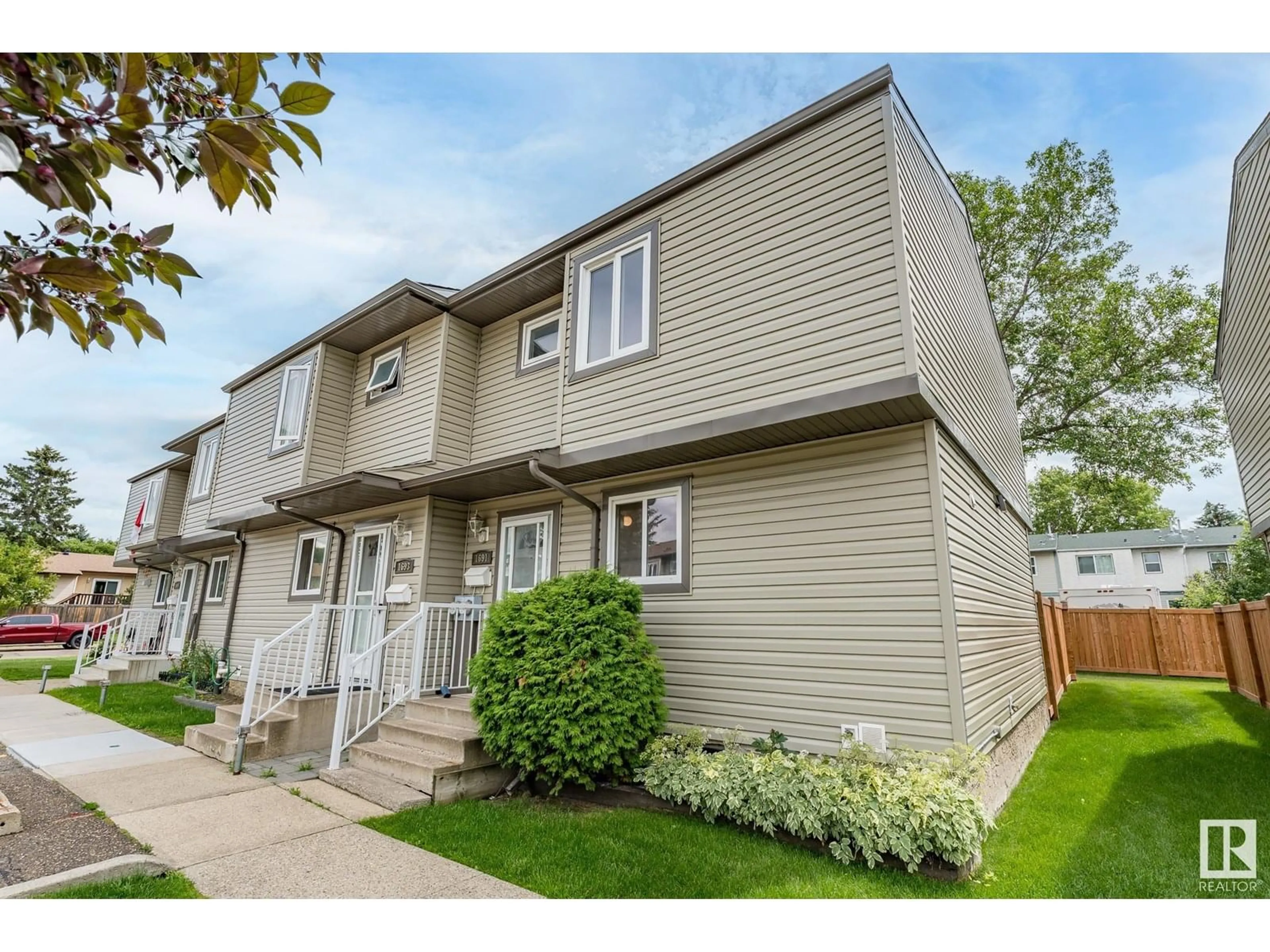 Home with vinyl exterior material, street for 1691 LAKEWOOD RD, Edmonton Alberta T6K3B9