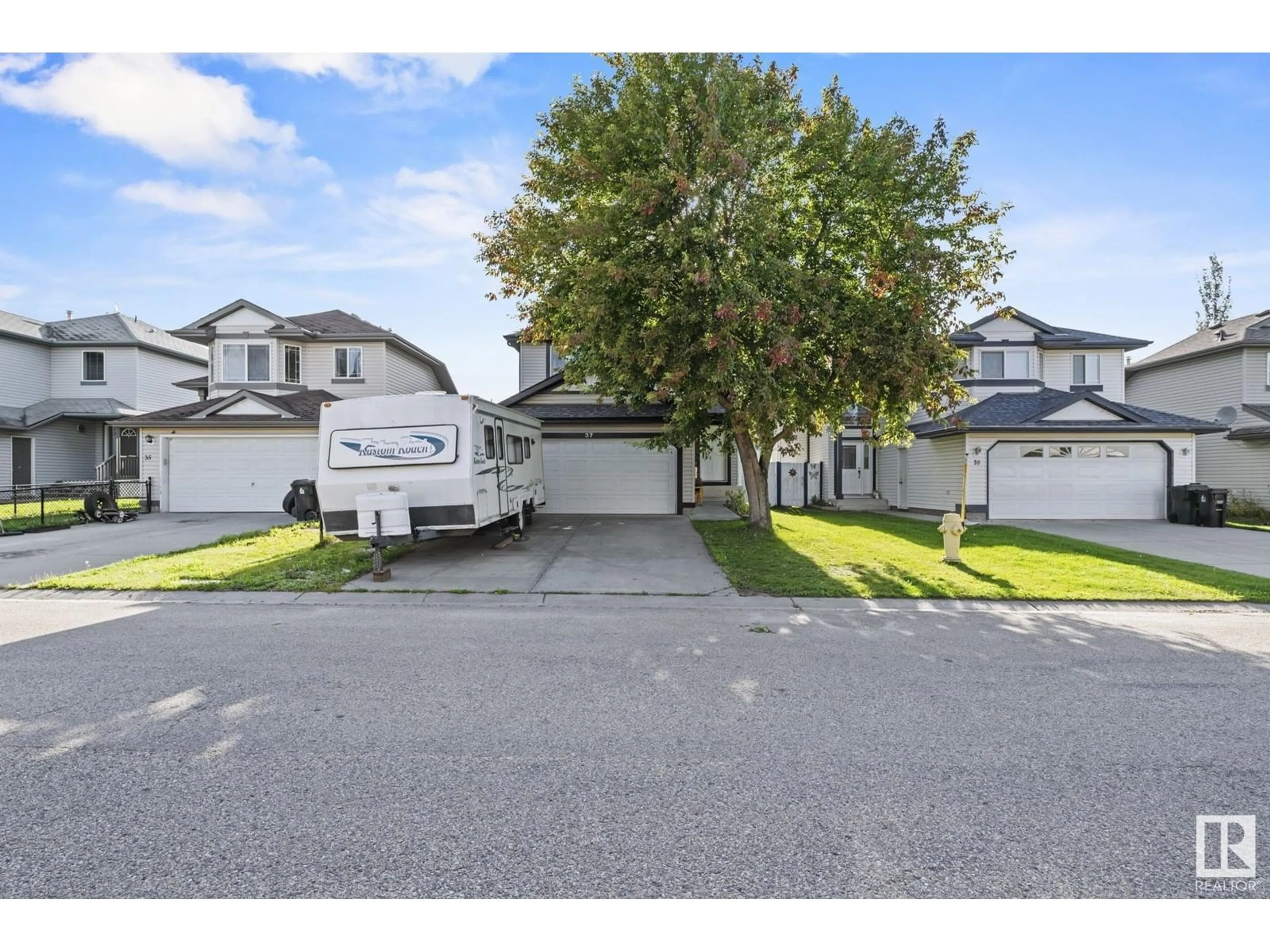 A pic from outside/outdoor area/front of a property/back of a property/a pic from drone, street for 37 HIGHLANDS WY, Spruce Grove Alberta T7X4L4