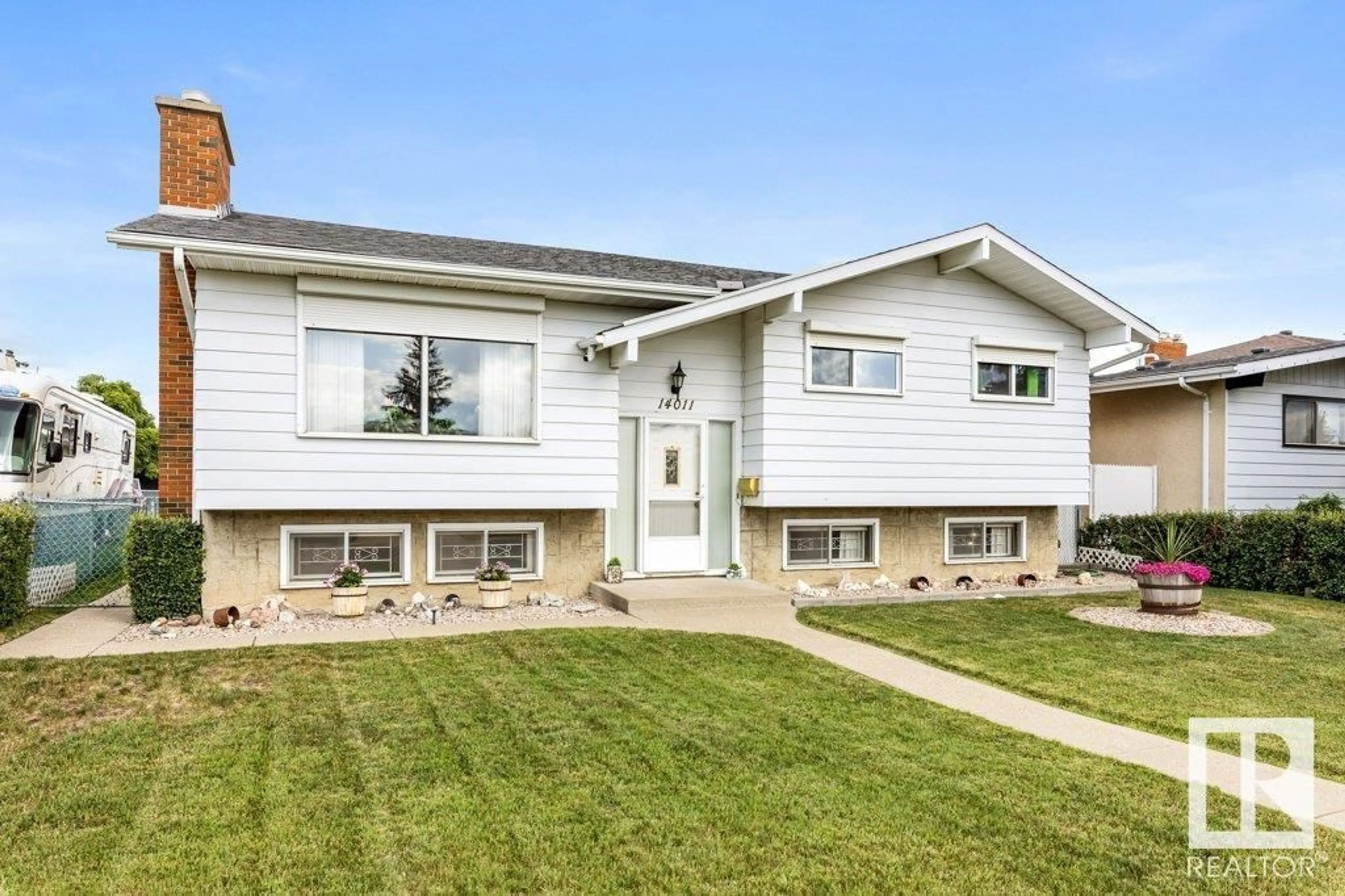 Home with vinyl exterior material, street for 14011 96 ST, Edmonton Alberta T5E5Z3