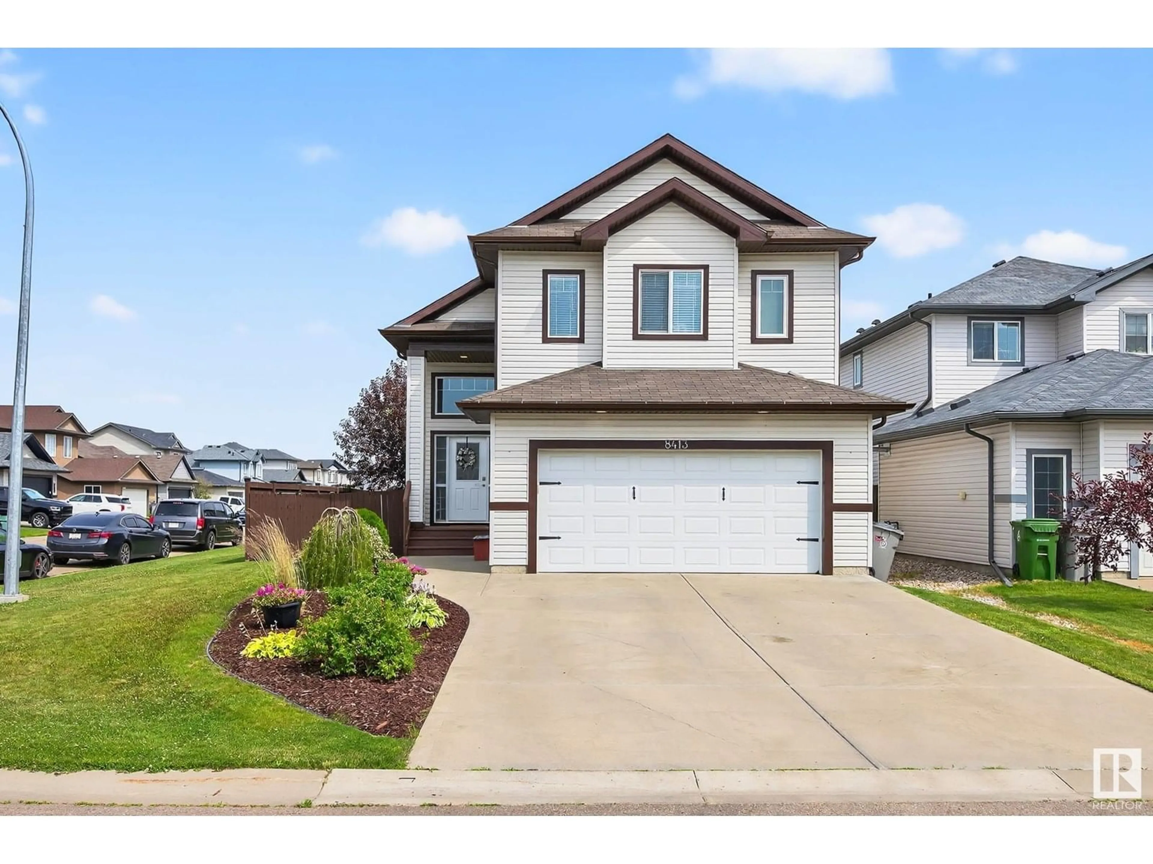 Home with vinyl exterior material, street for 8413 97 ST, Morinville Alberta T8R0A5